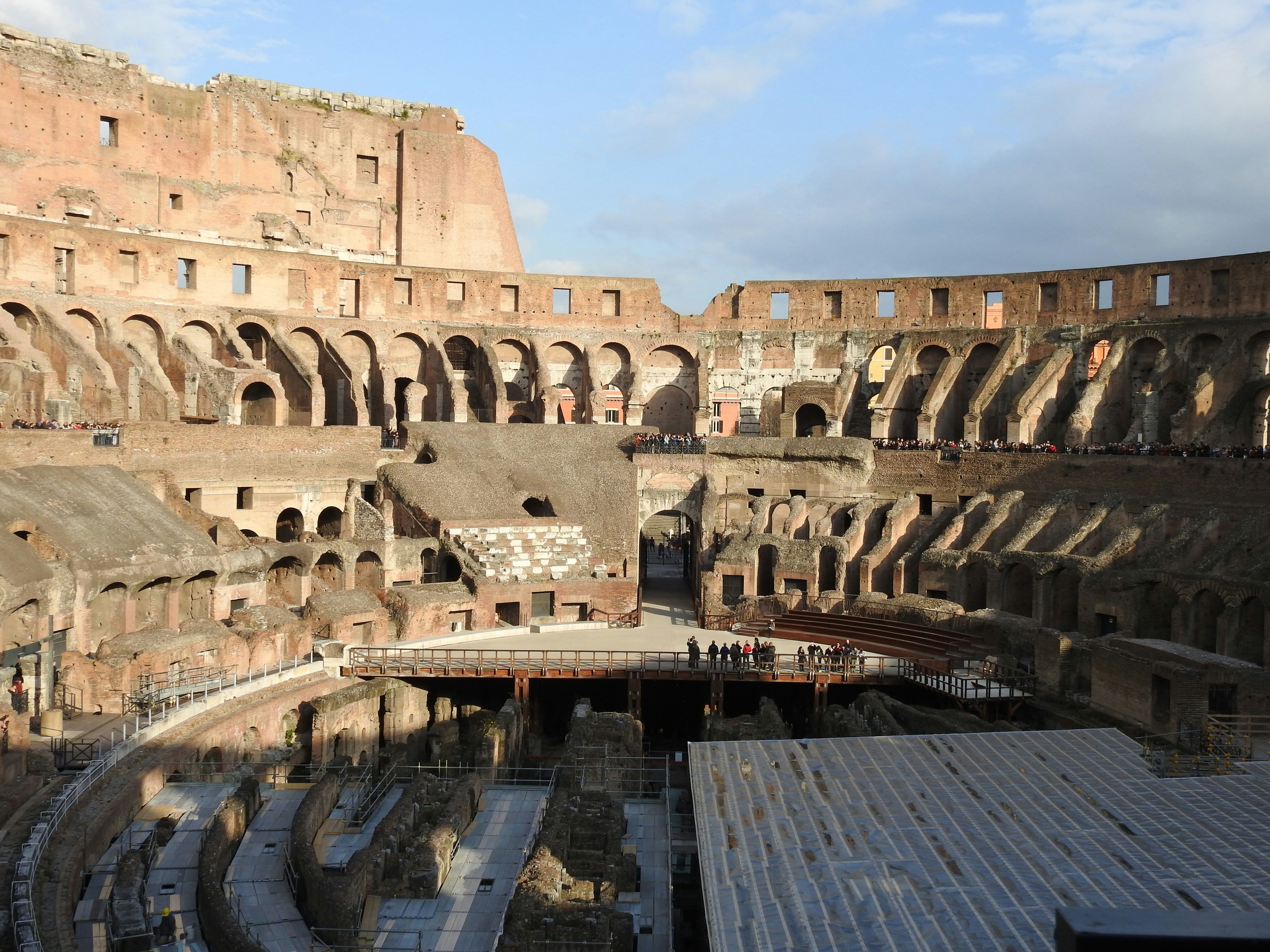 The interior of a large building with a sky background