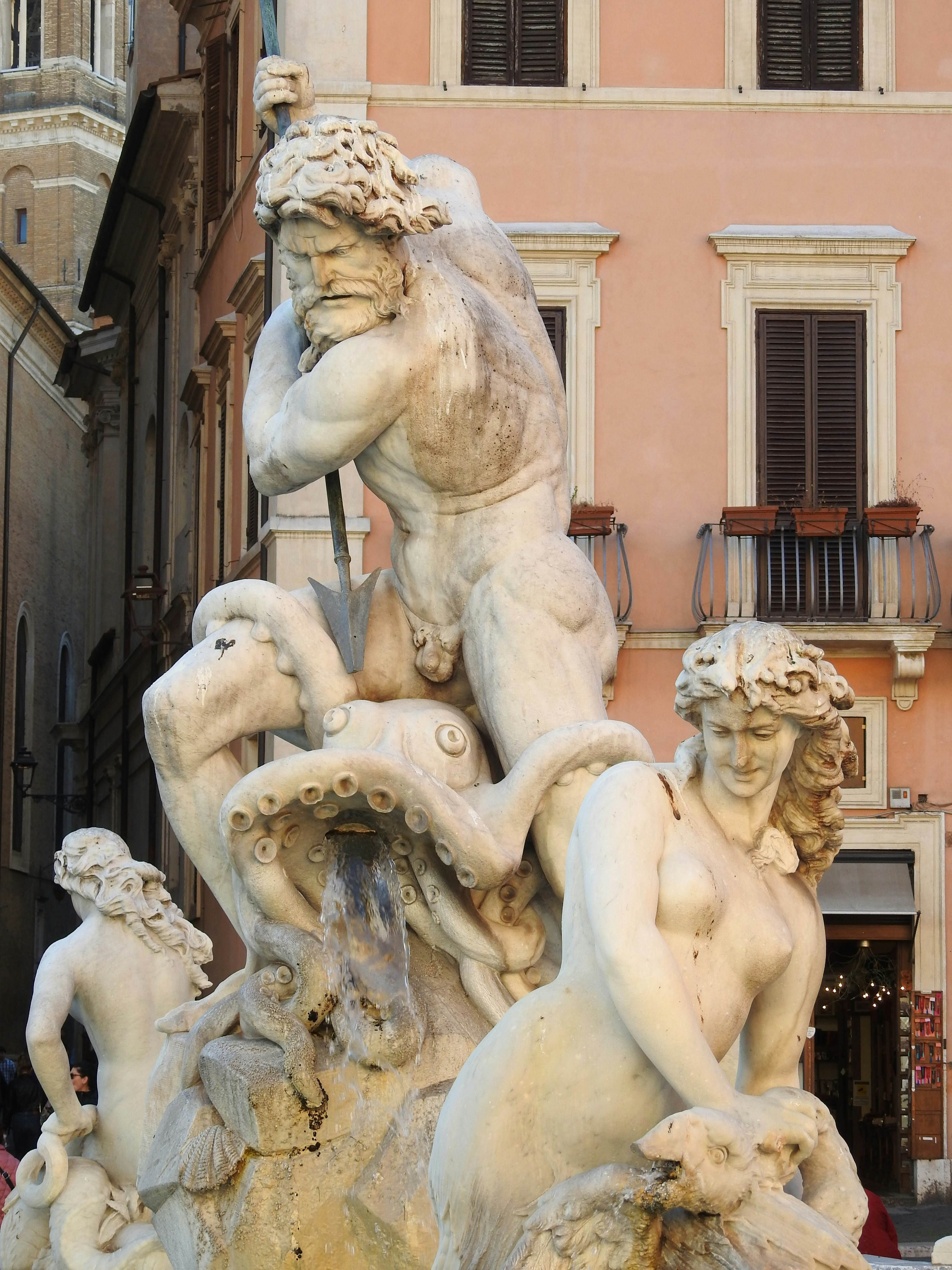A group of statues in front of a building