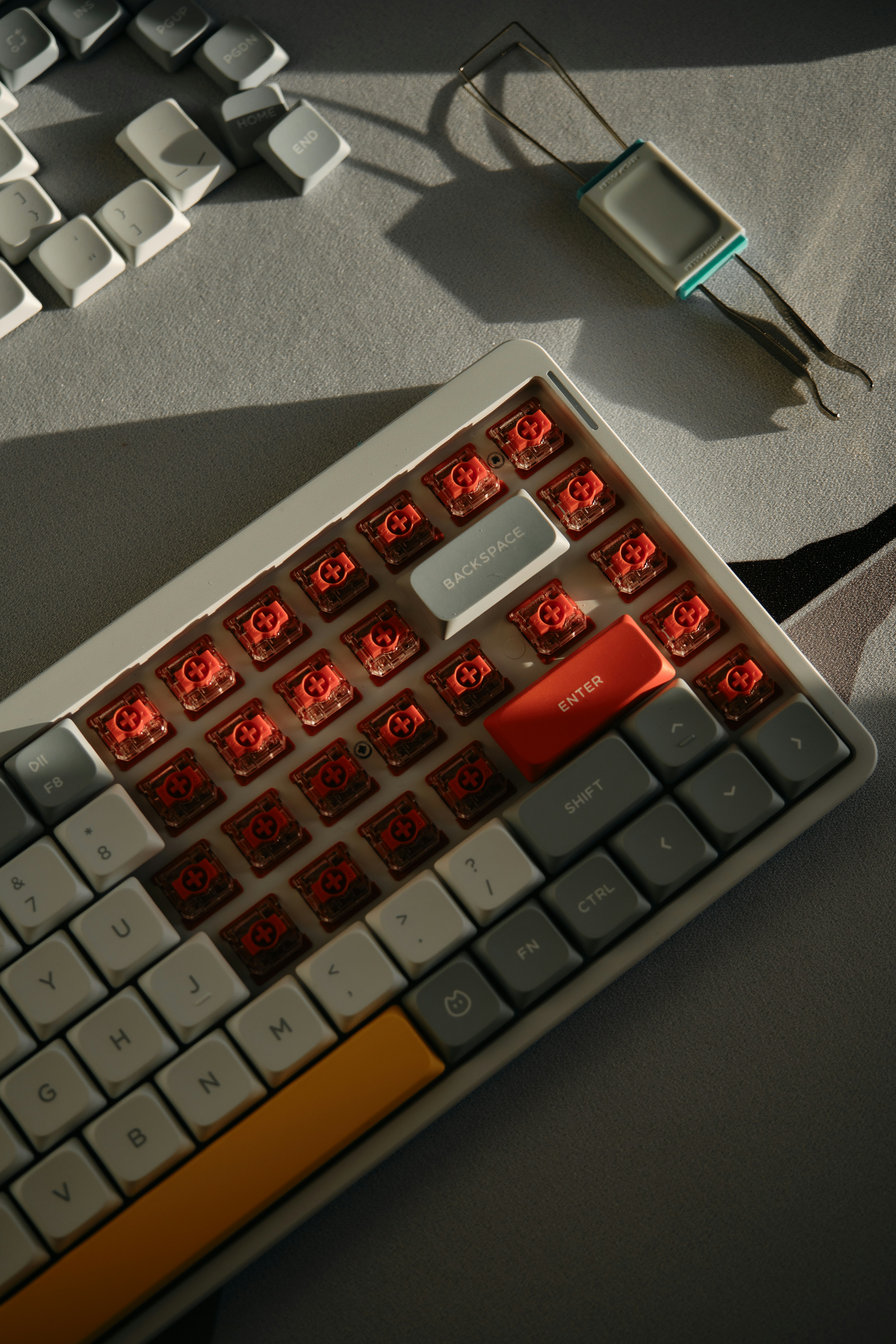 A computer keyboard sitting on top of a table