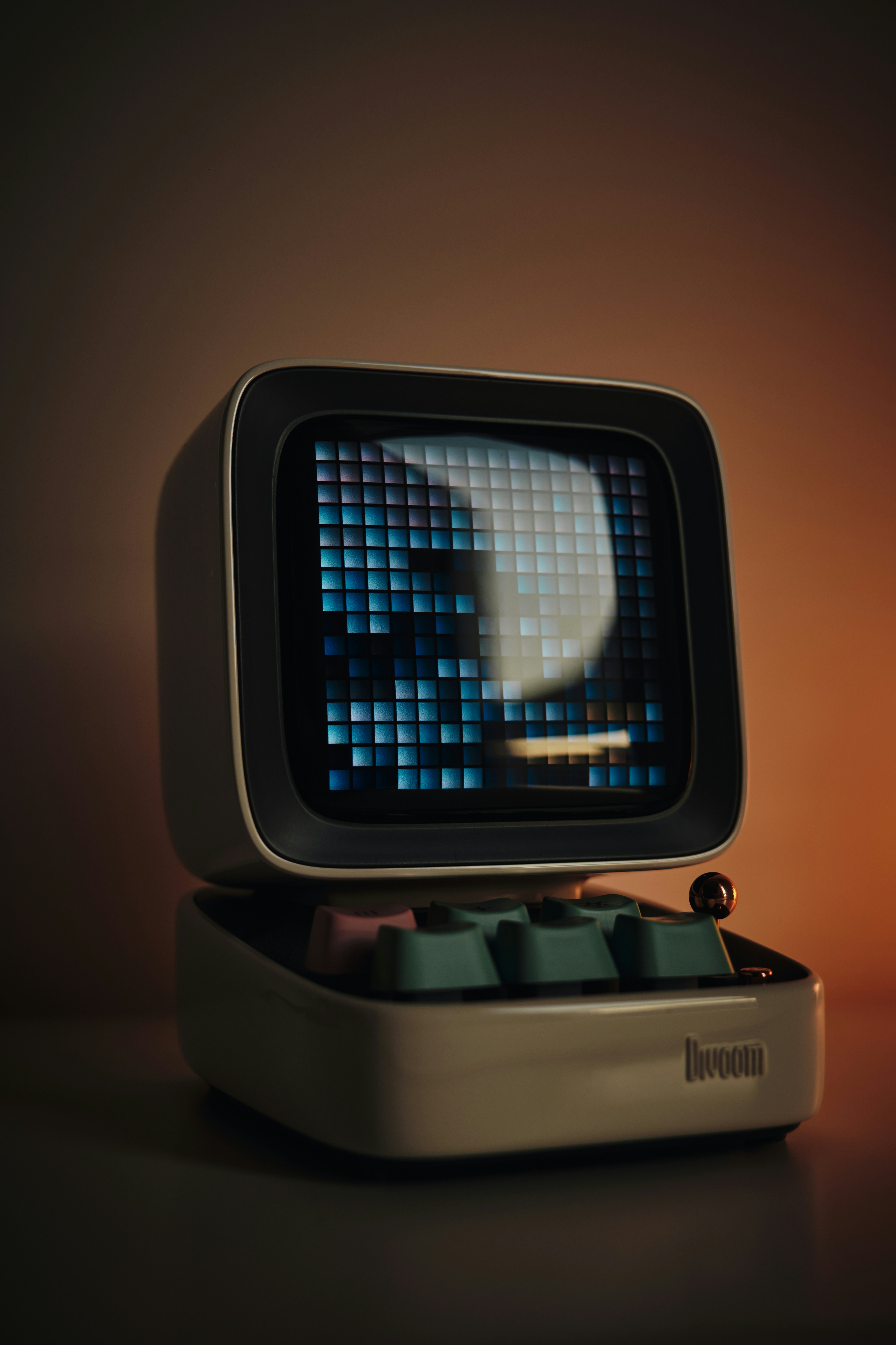 An old computer with a skull on the screen