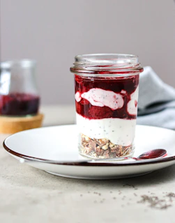 A jar of food sitting on top of a white plate