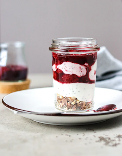 A jar of food sitting on top of a white plate