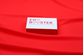 A red cloth with a business card on it