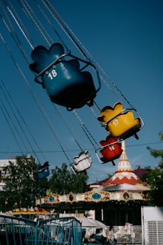 A carnival ride with mickey mouse and other rides