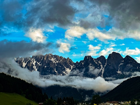 A view of a mountain range covered in clouds