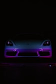 A car in the dark with a purple light