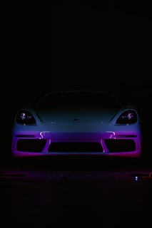 A car in the dark with a purple light