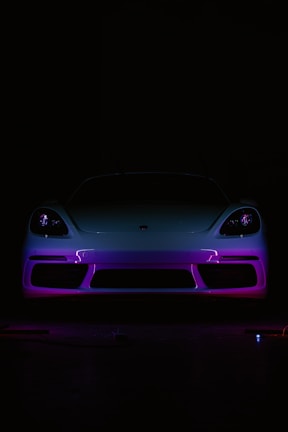 A car in the dark with a purple light