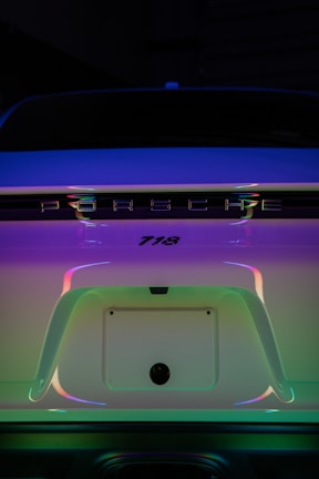 The back end of a car with the trunk light on