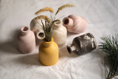 A group of vases sitting on top of a bed