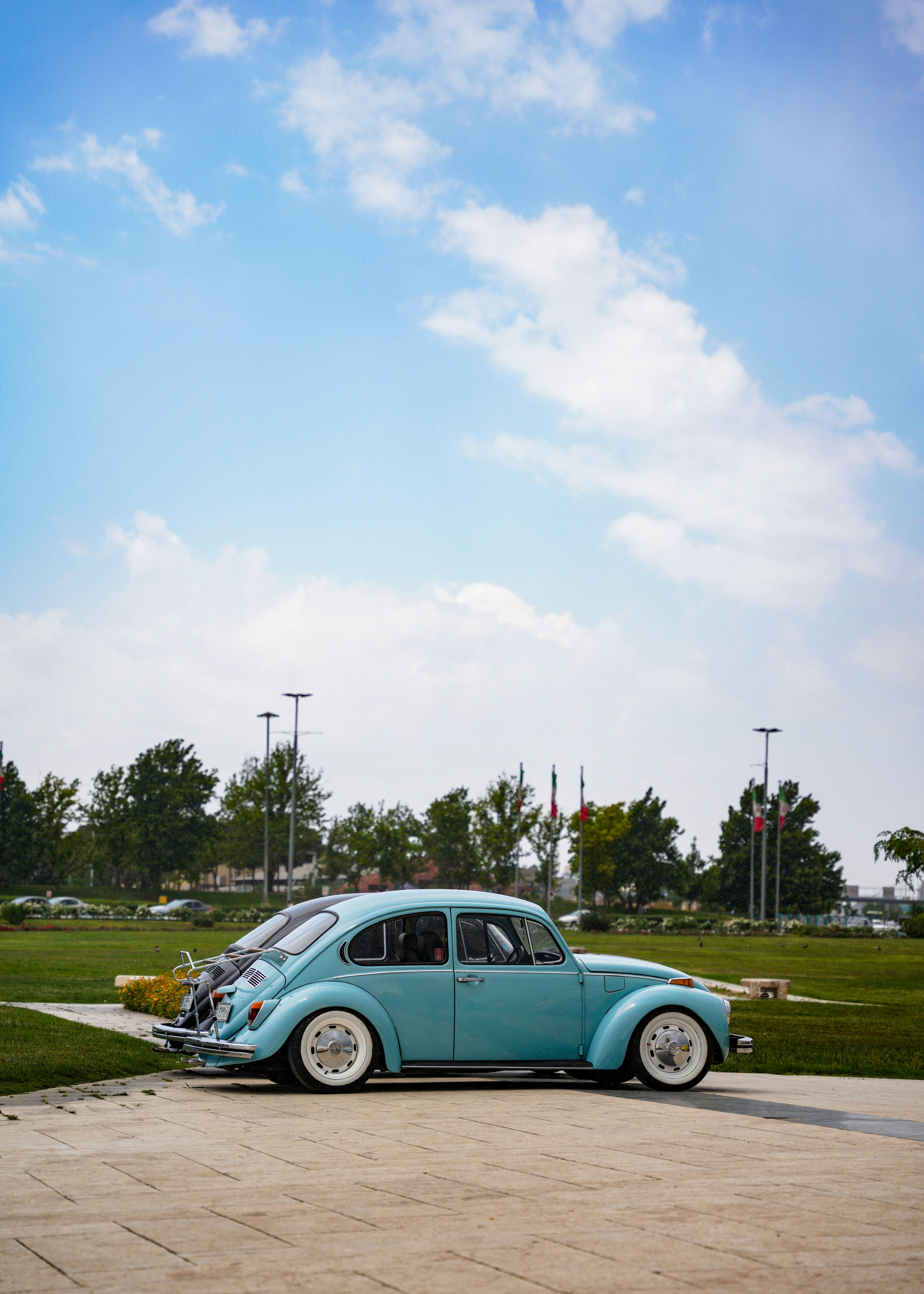 A blue car parked in a parking lot
