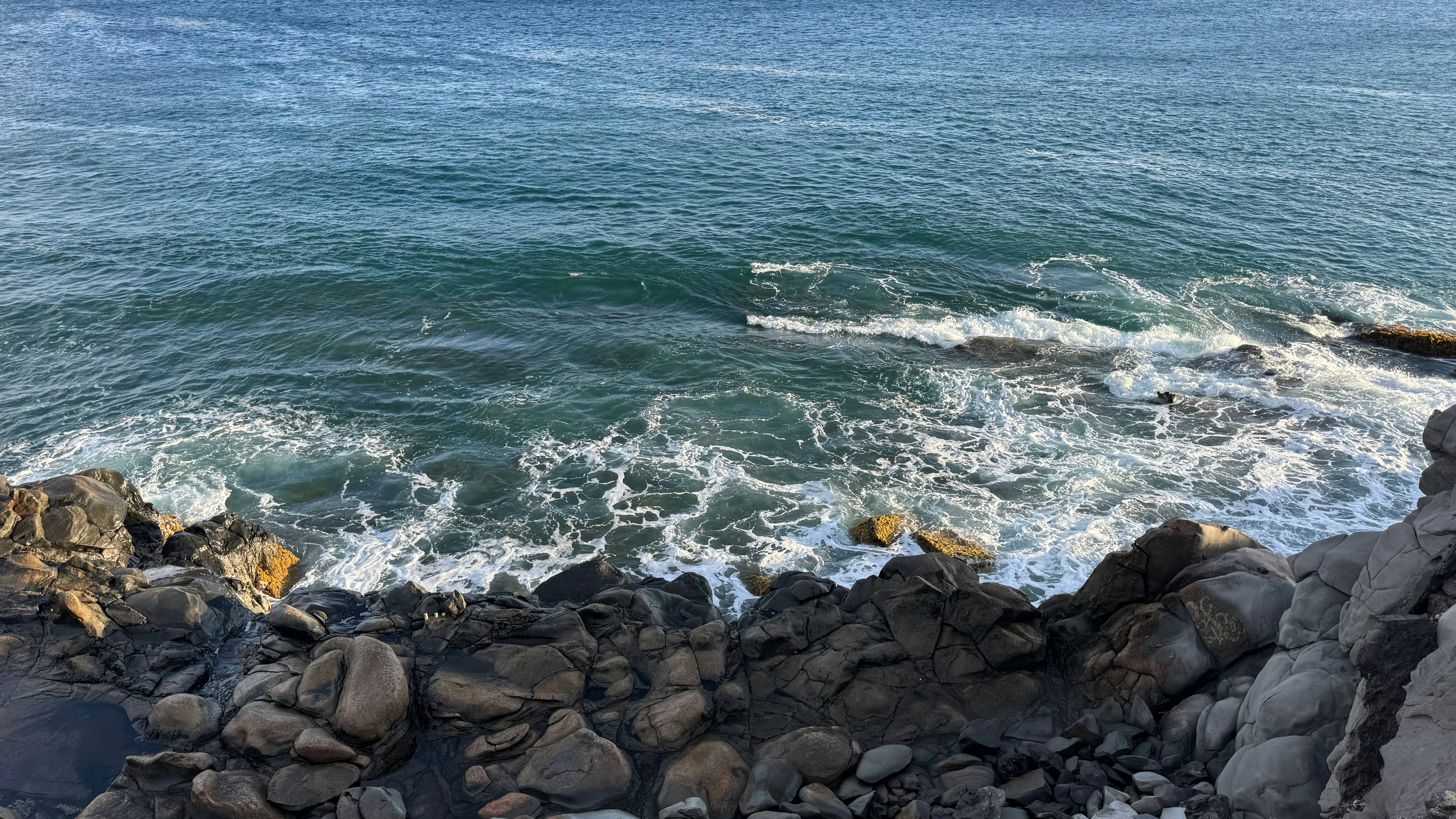 A view of the ocean from a rocky shore, 
