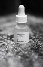 A bottle of ordinary sitting on a table
