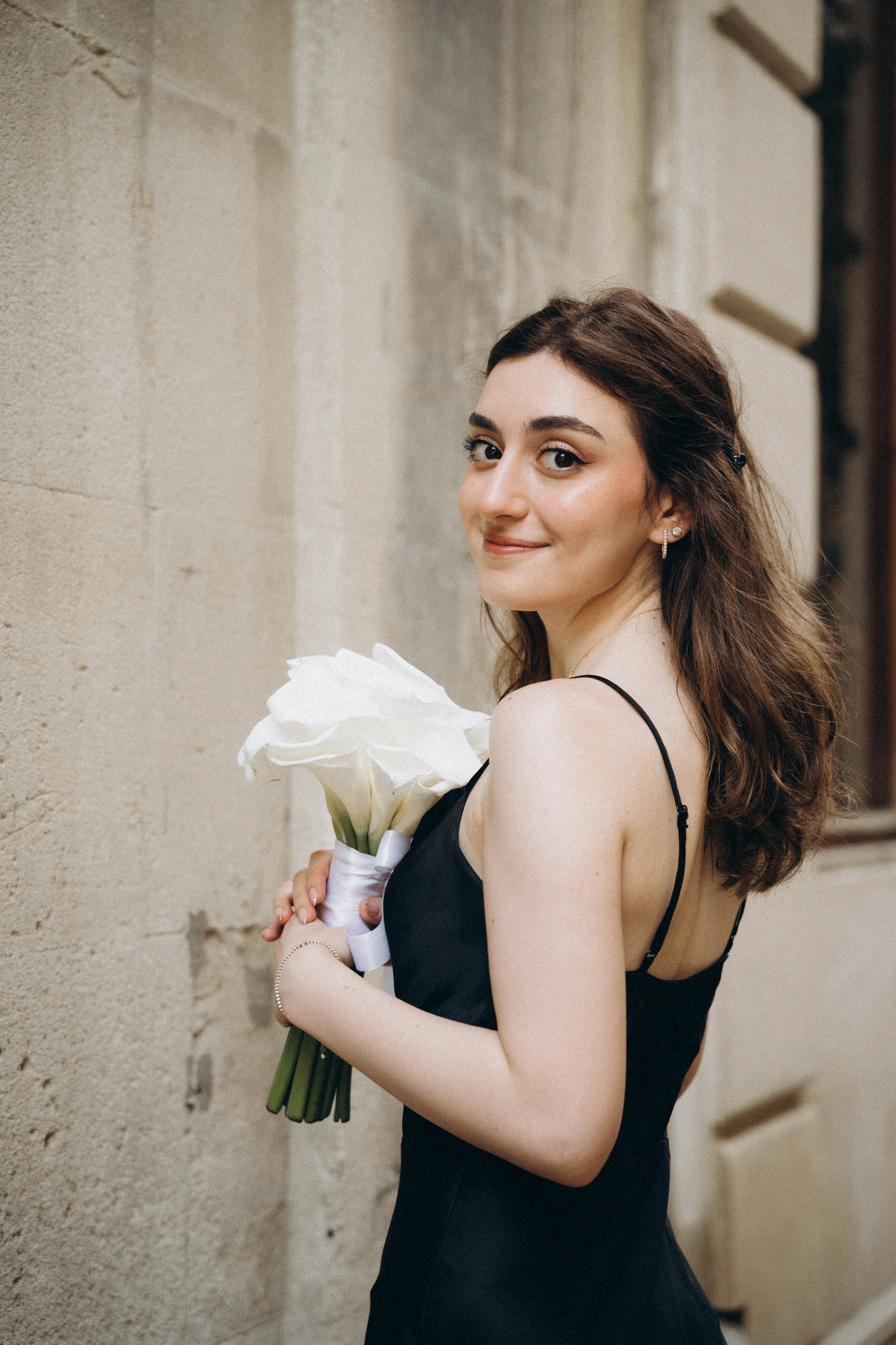 flower bouquet with black dress We love how classy black bridesmaids dresses look! Especially paired with  bouquets full of white flowers & green Amaranthus!