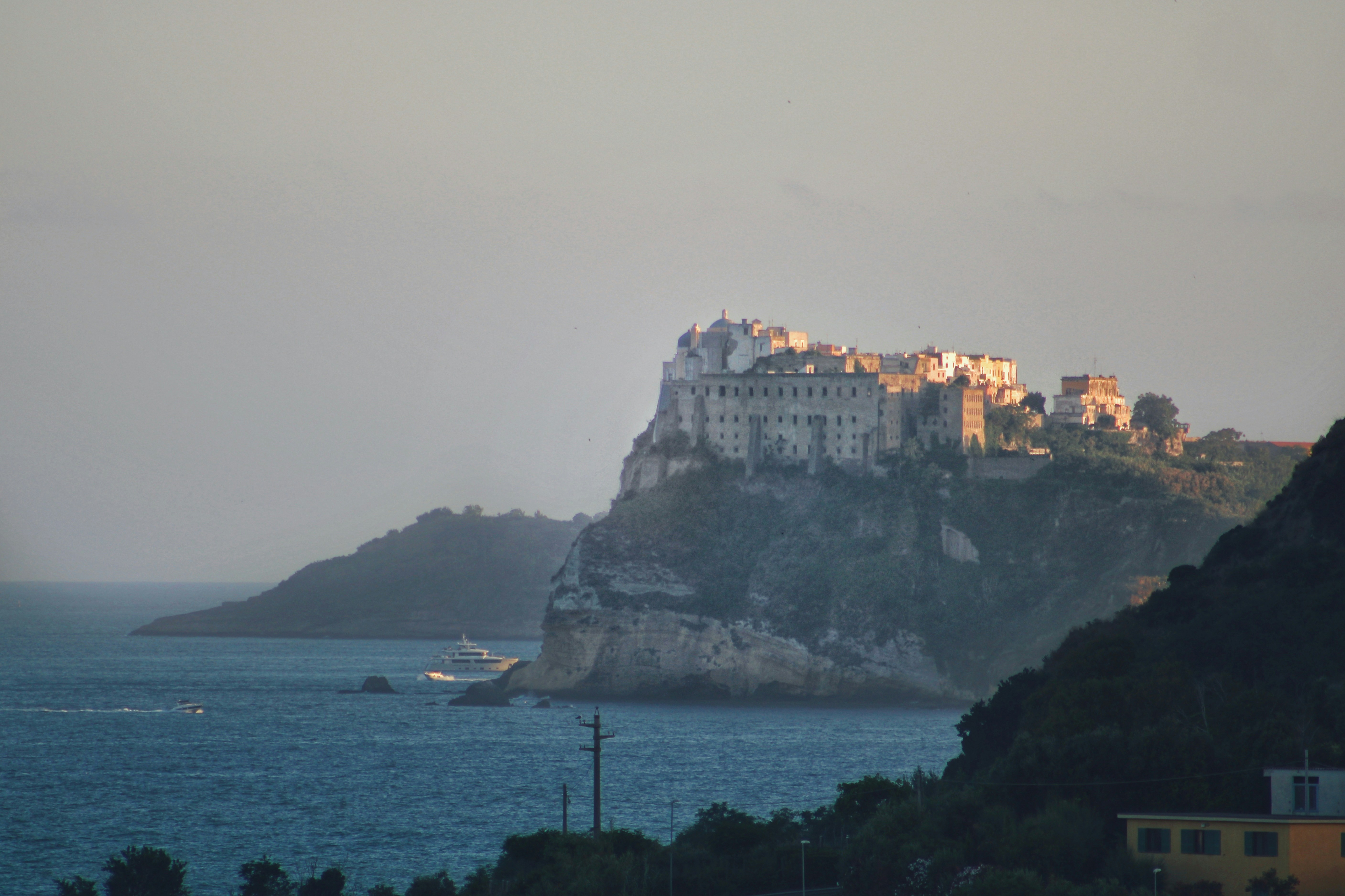 A view of a castle on top of a hill