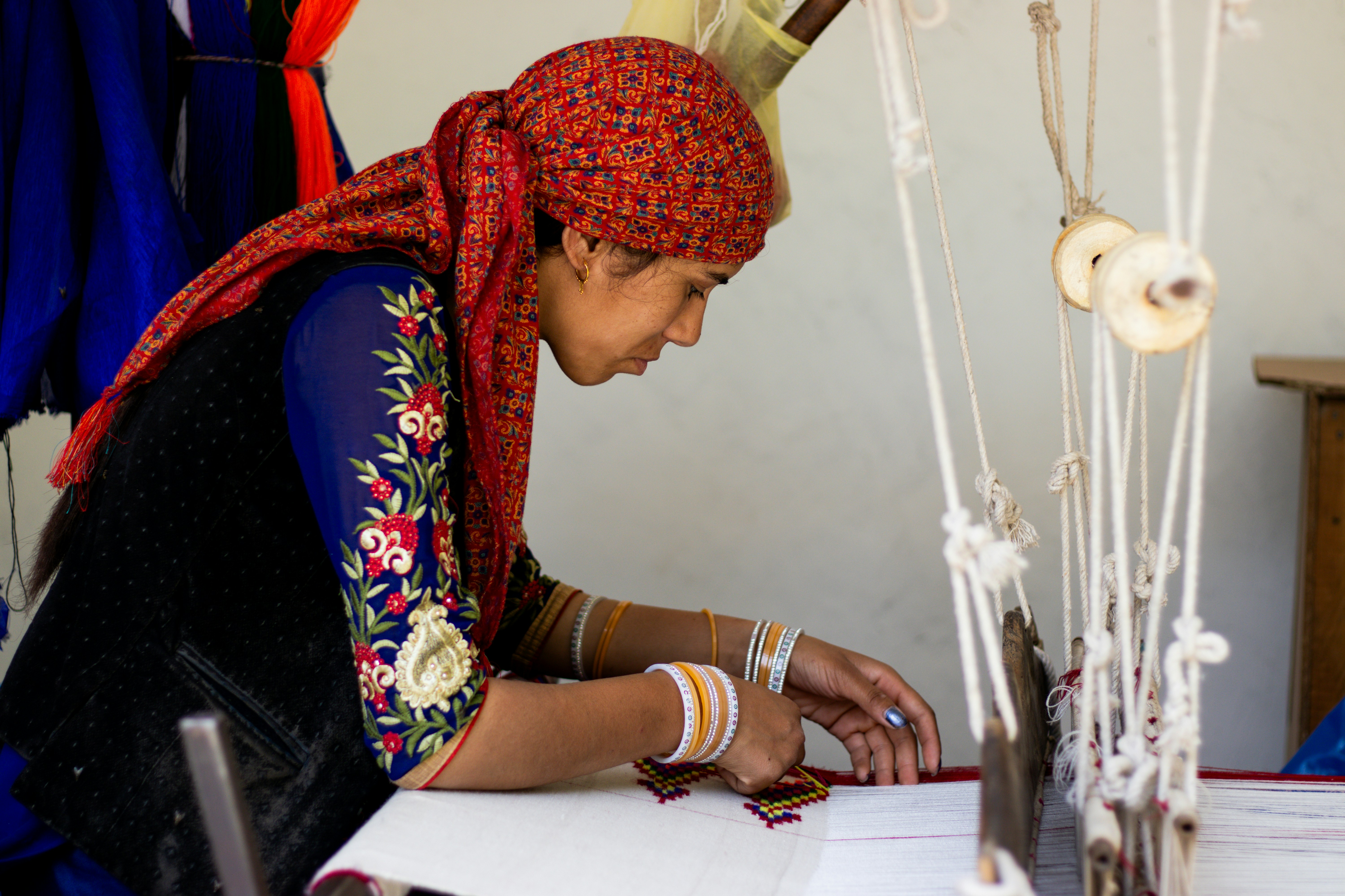A woman working on a project in a room