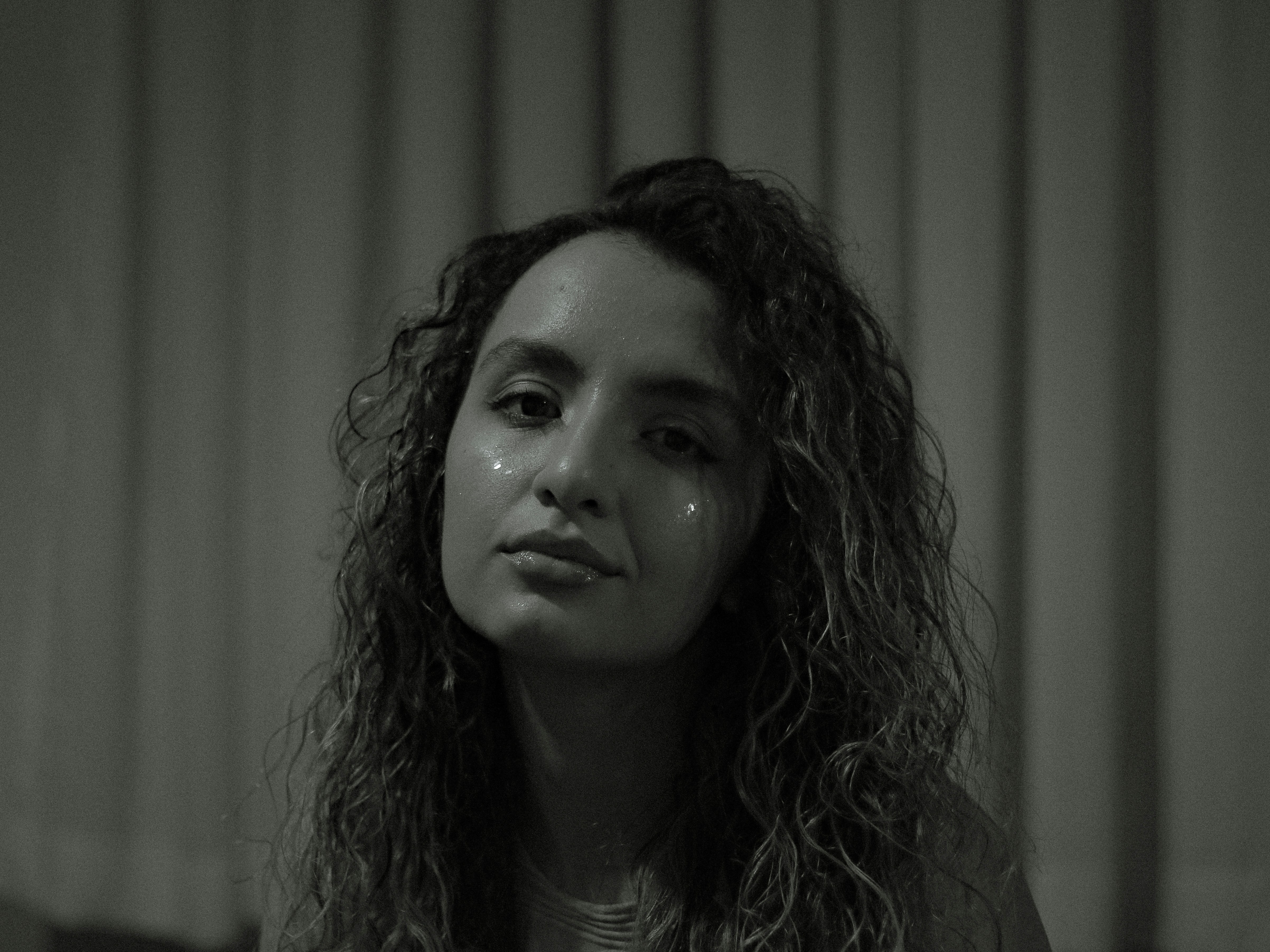 A black and white photo of a woman with long hair