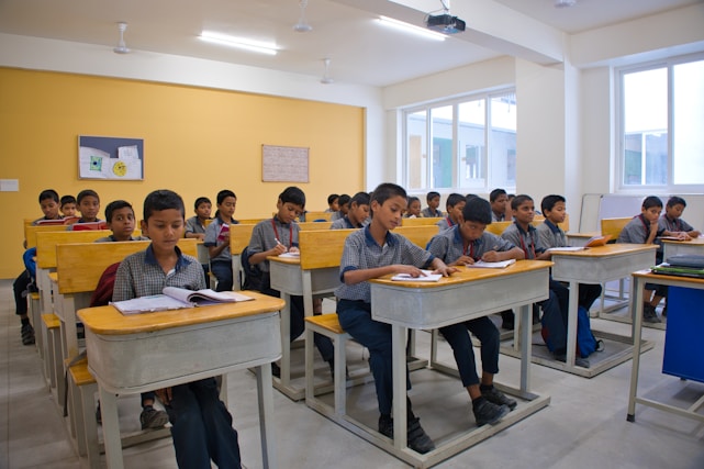 A group of children sitting at desks in a classroom