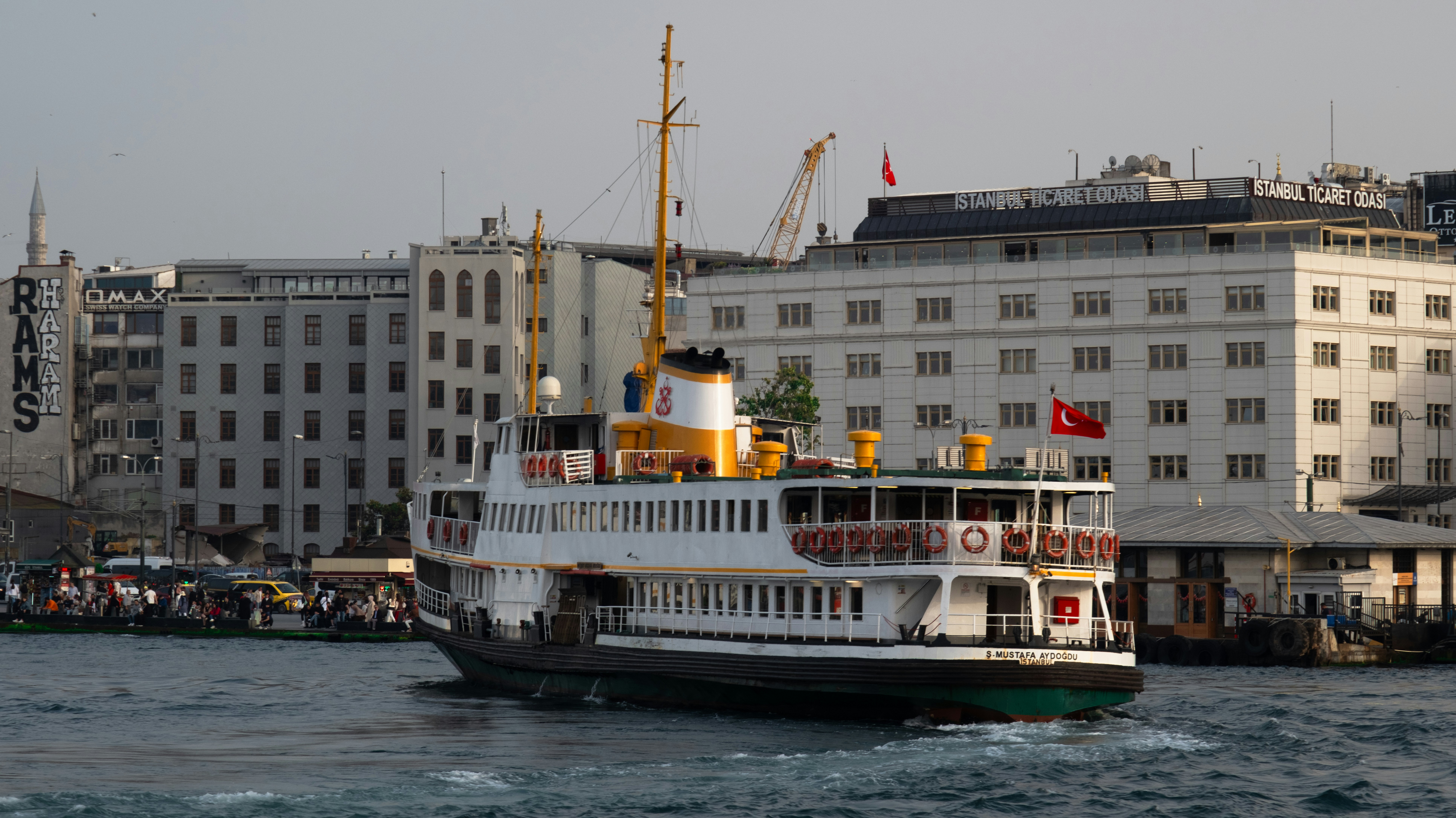 A large boat floating on top of a body of water