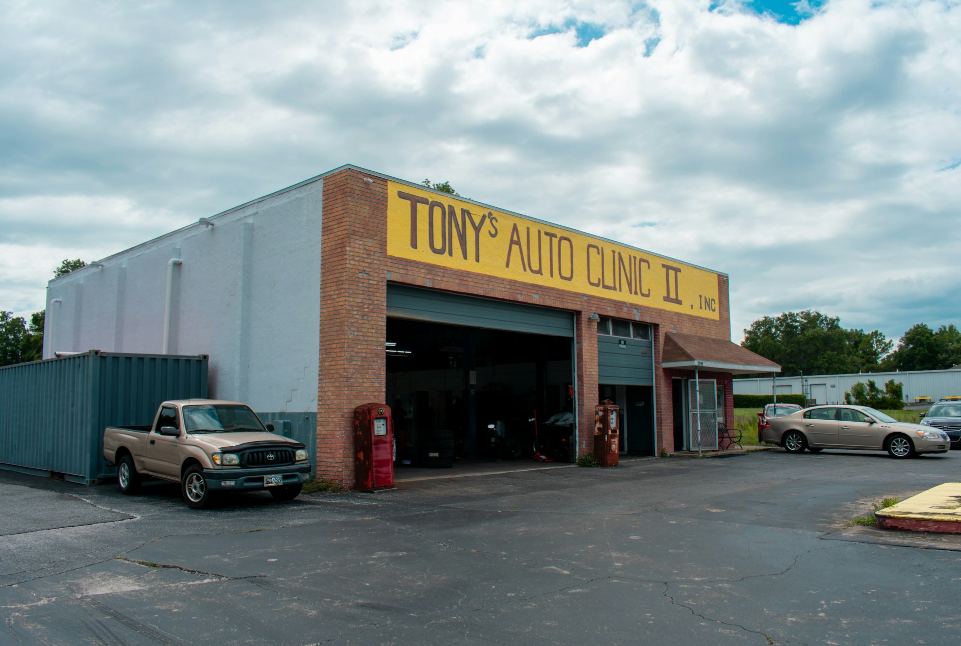 A truck is parked in front of a building