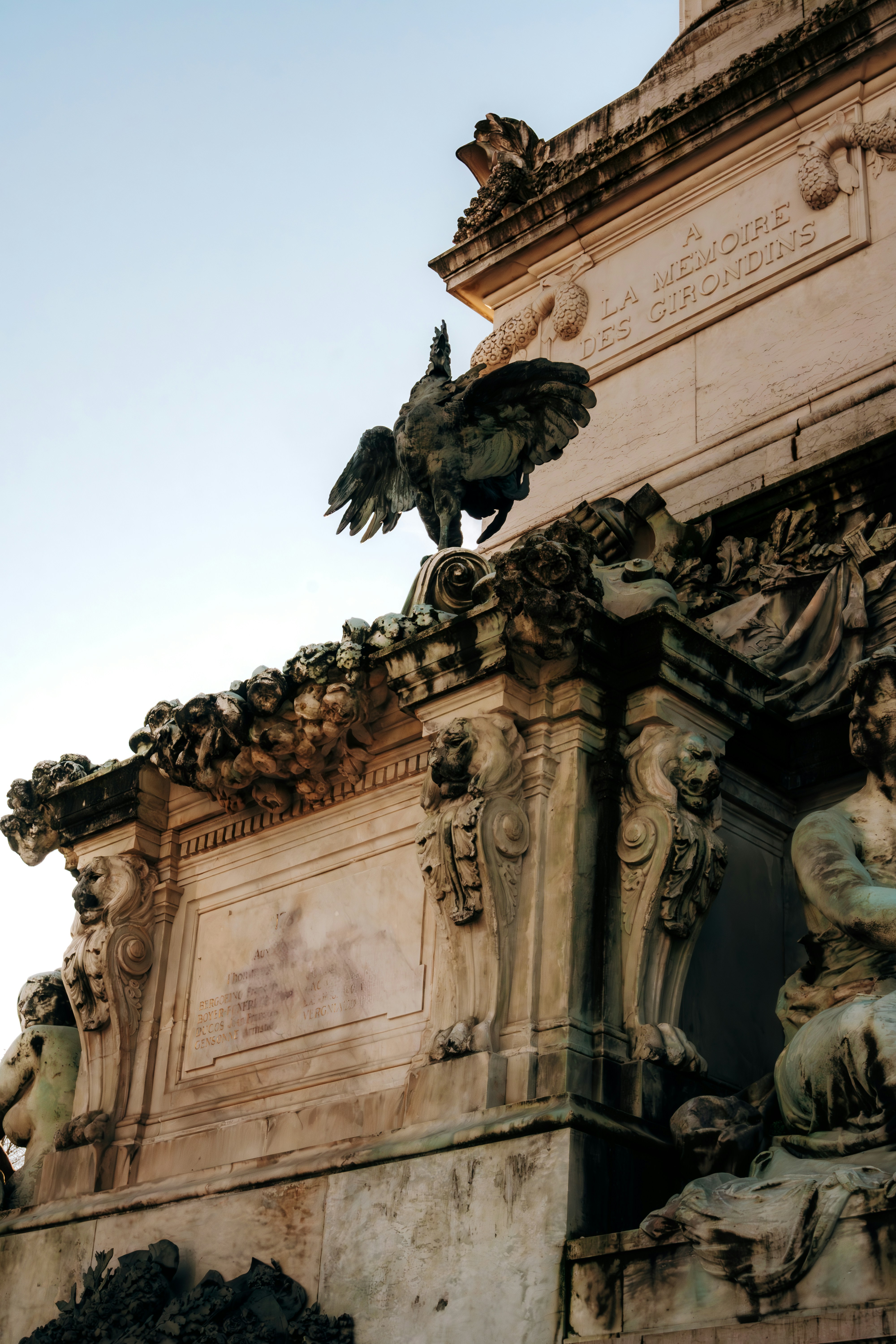 A statue with a bird on top of it