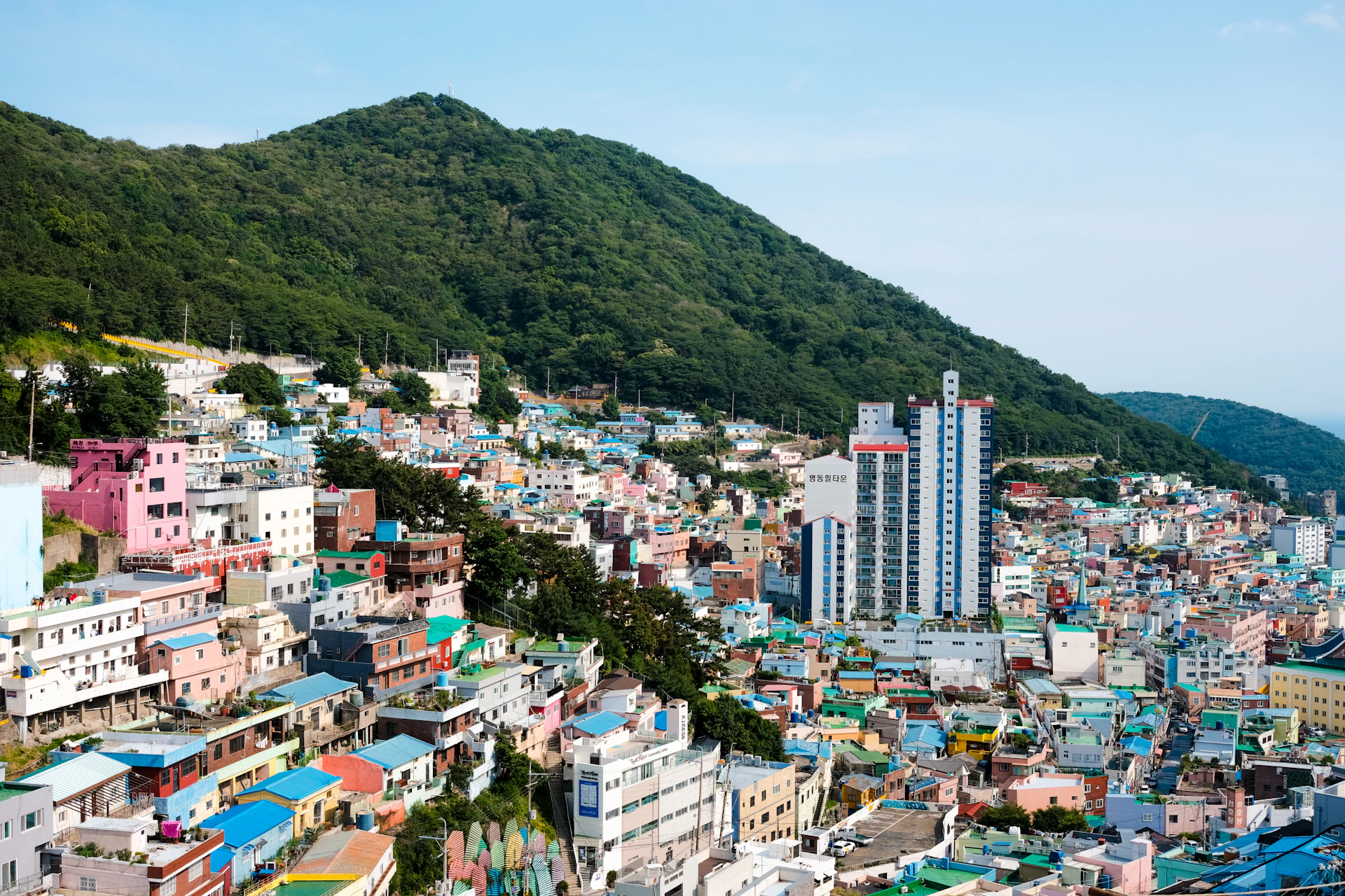 A view of a city with mountains in the background