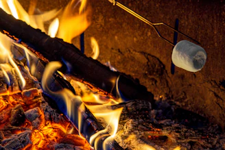 A close up of a grill with hot coals