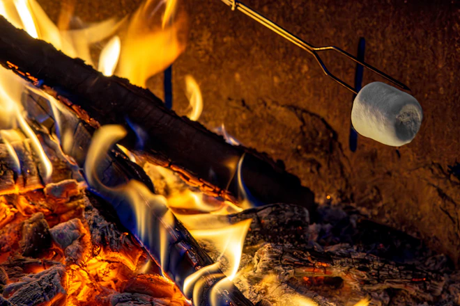 A close up of a grill with hot coals