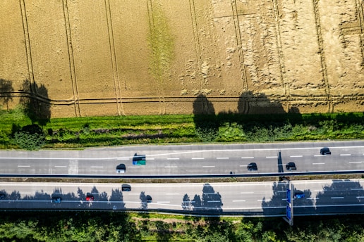 An aerial view of a highway with cars on it
