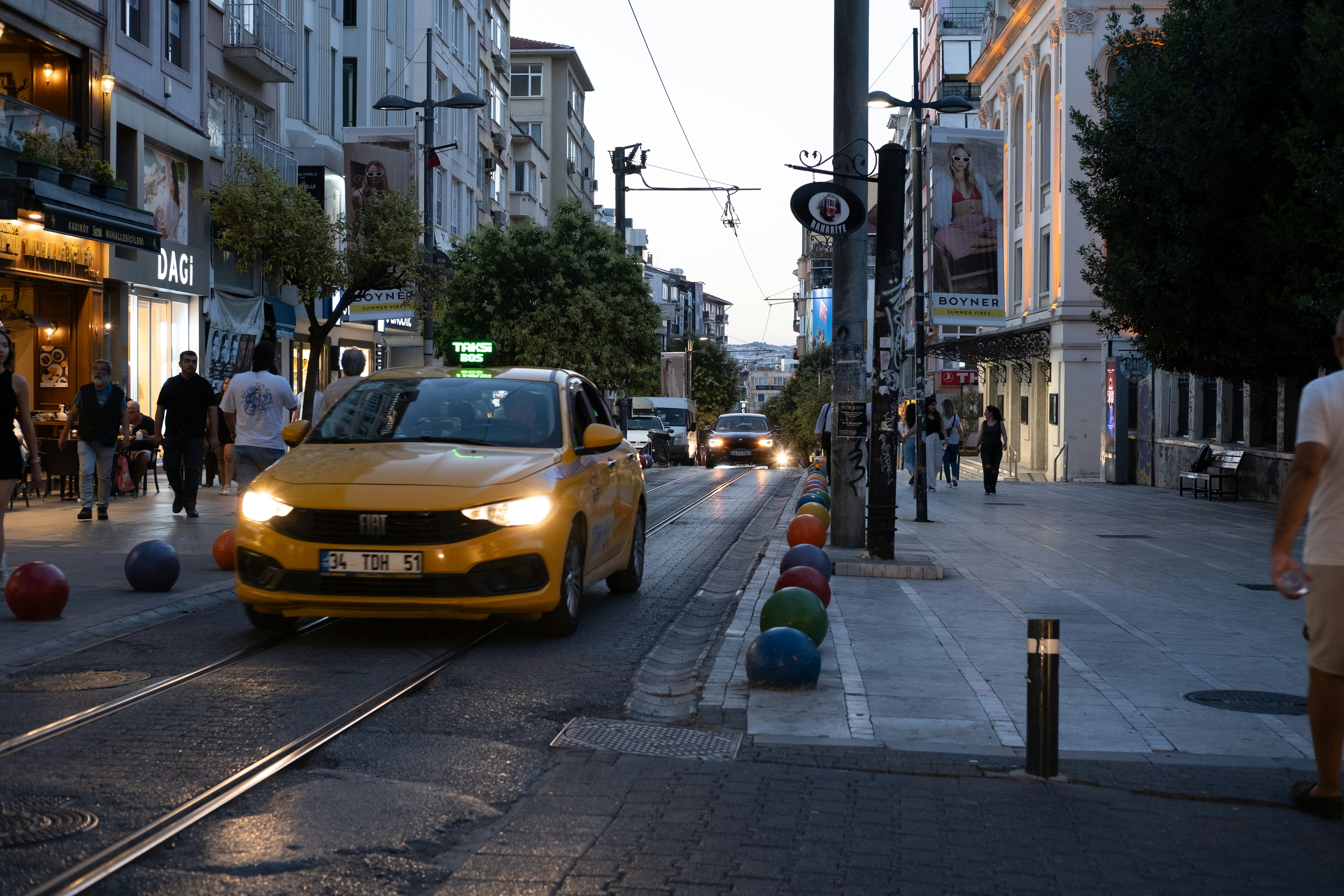 Modern electric SUV driving through a city street among other vehicles
