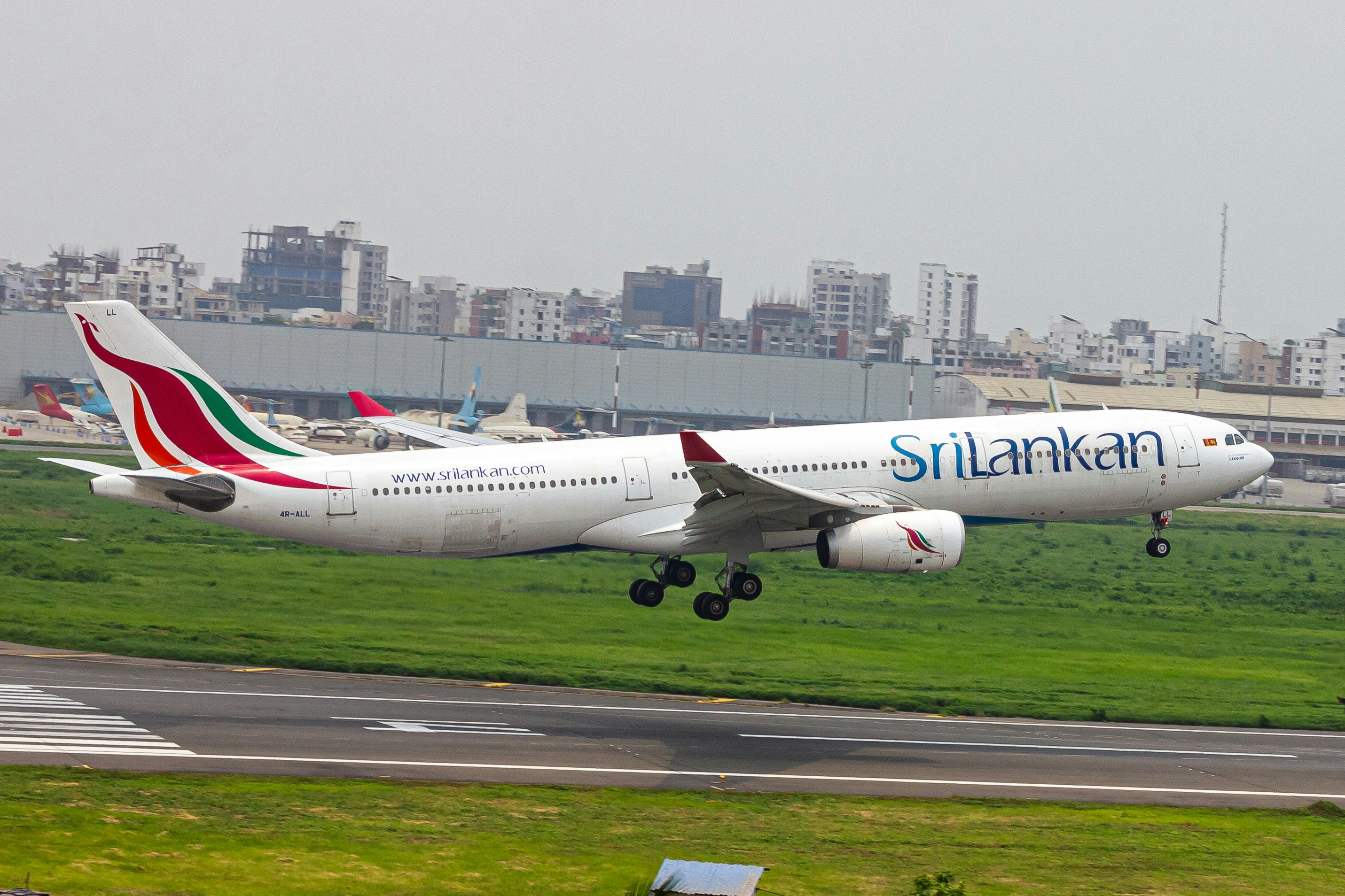 A large passenger jet taking off from an airport runway, SRILANKAN AIRLINES ✨