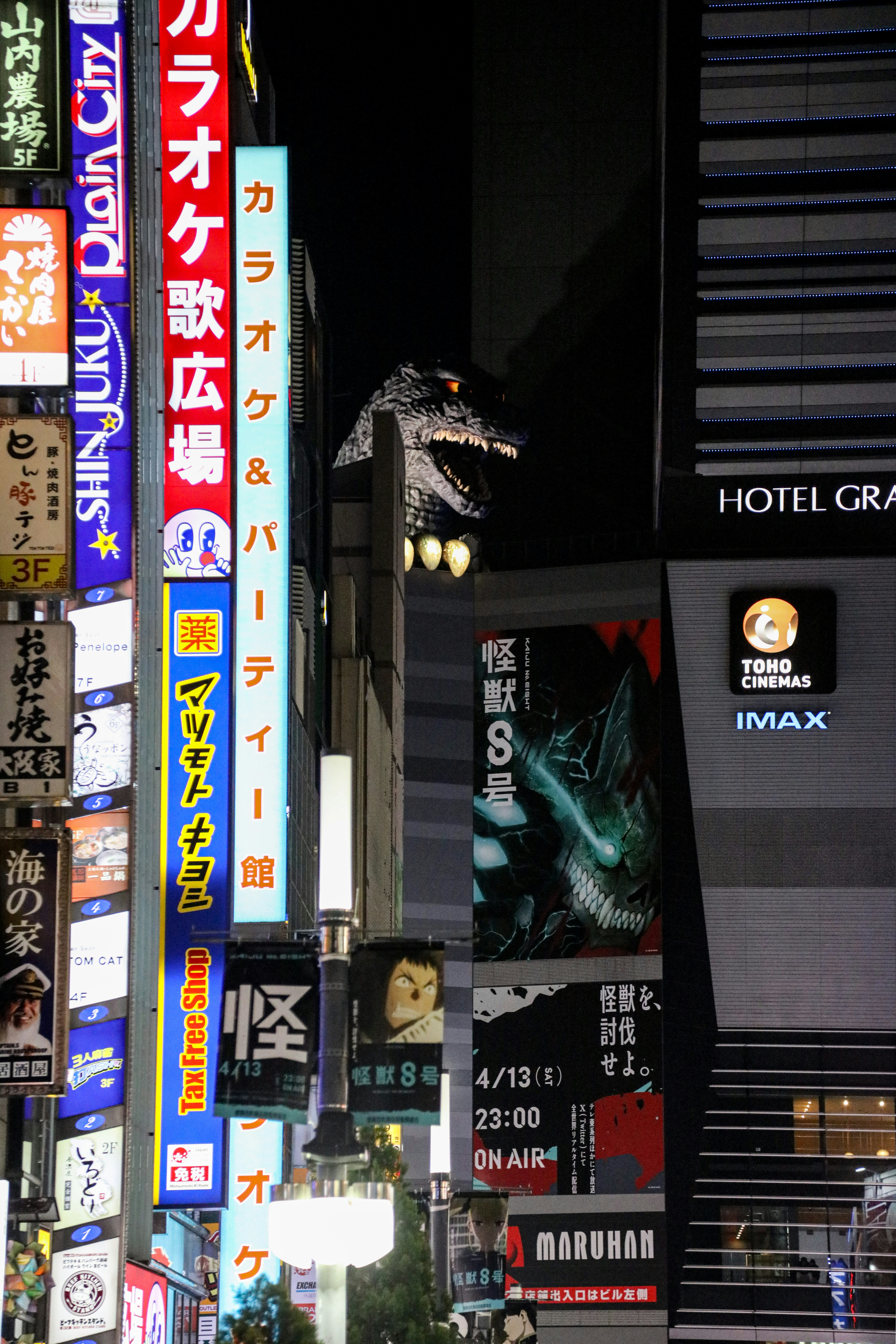A city street filled with lots of tall buildings