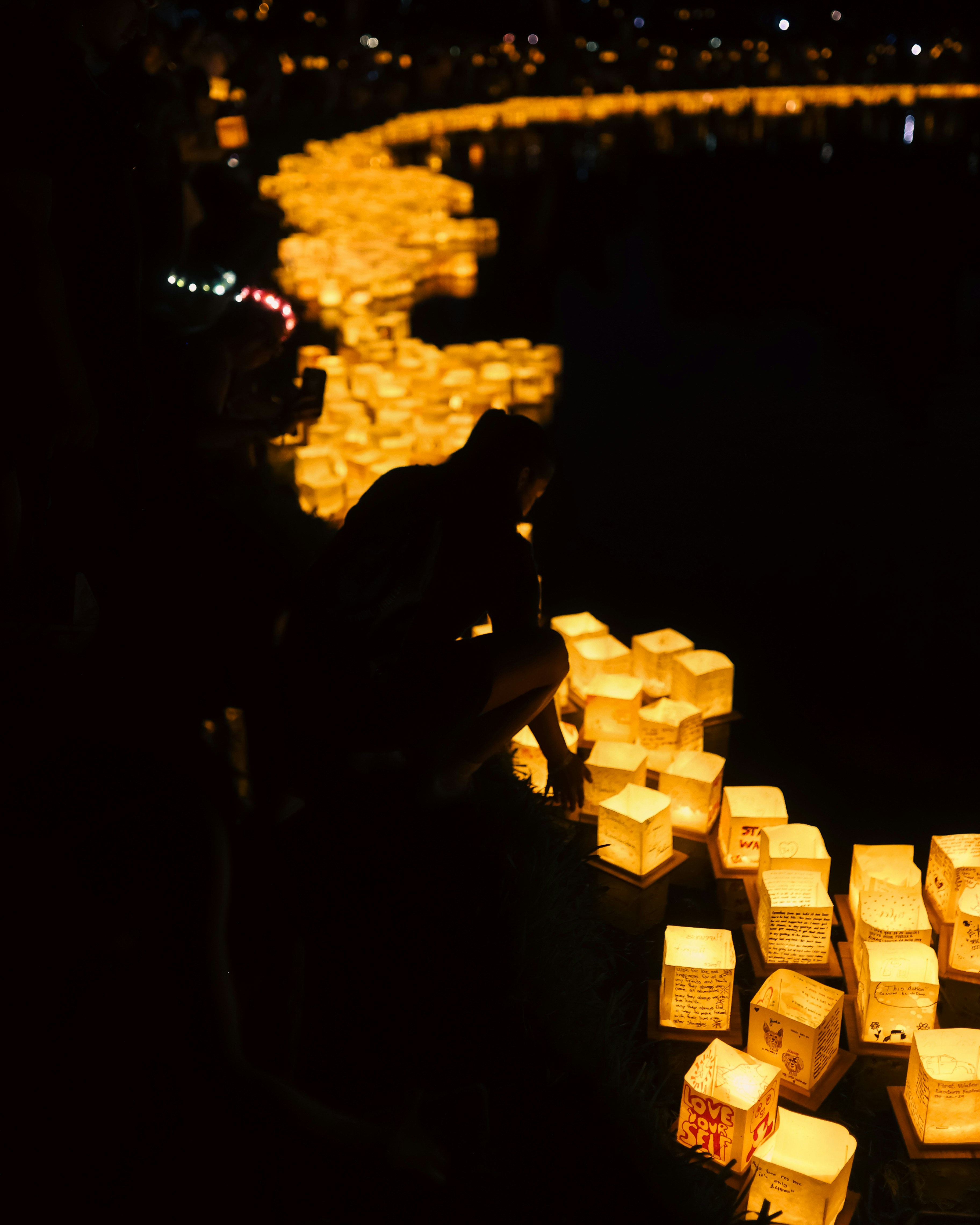 A group of lit candles sitting on top of a table