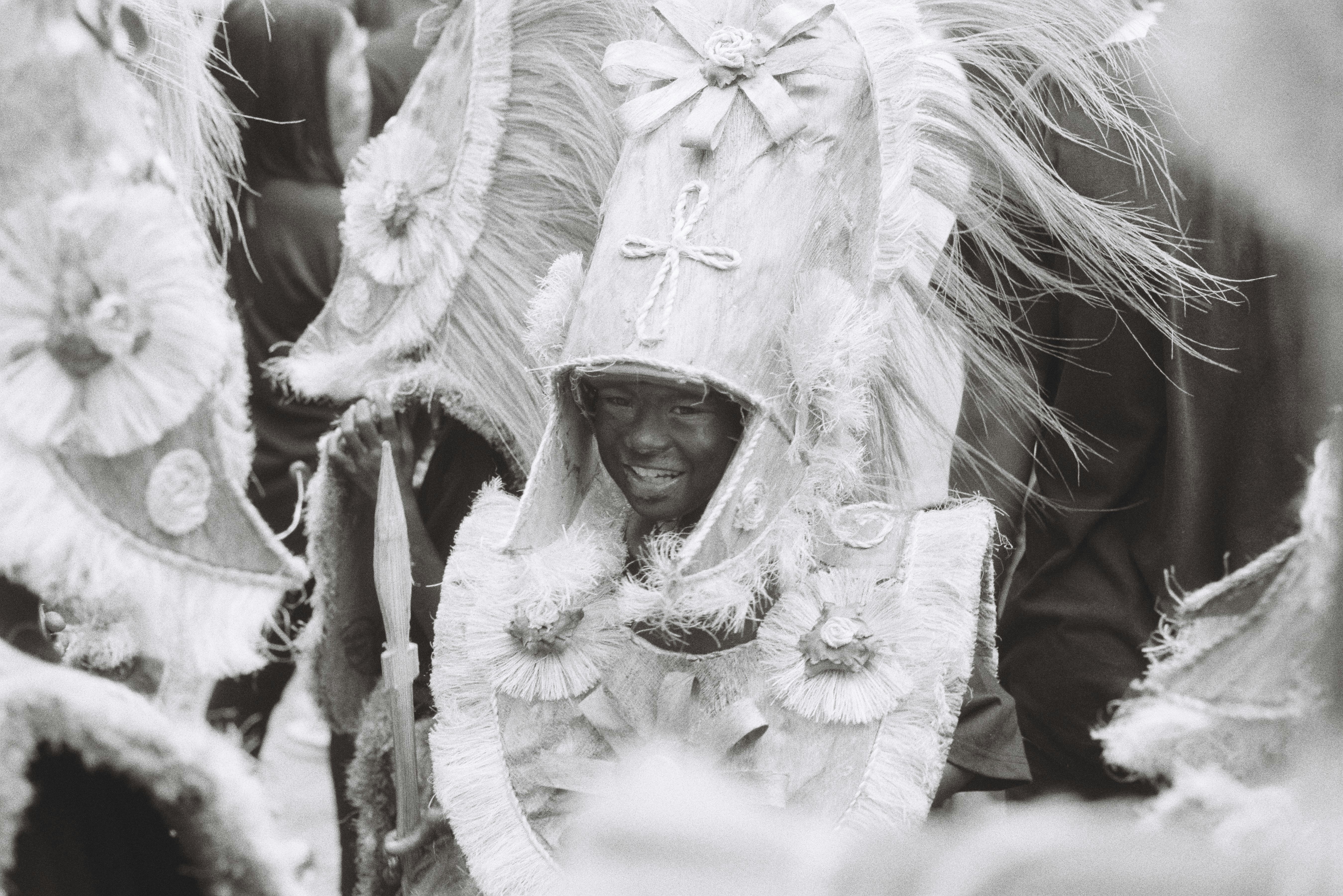 A black and white photo of a man in a costume