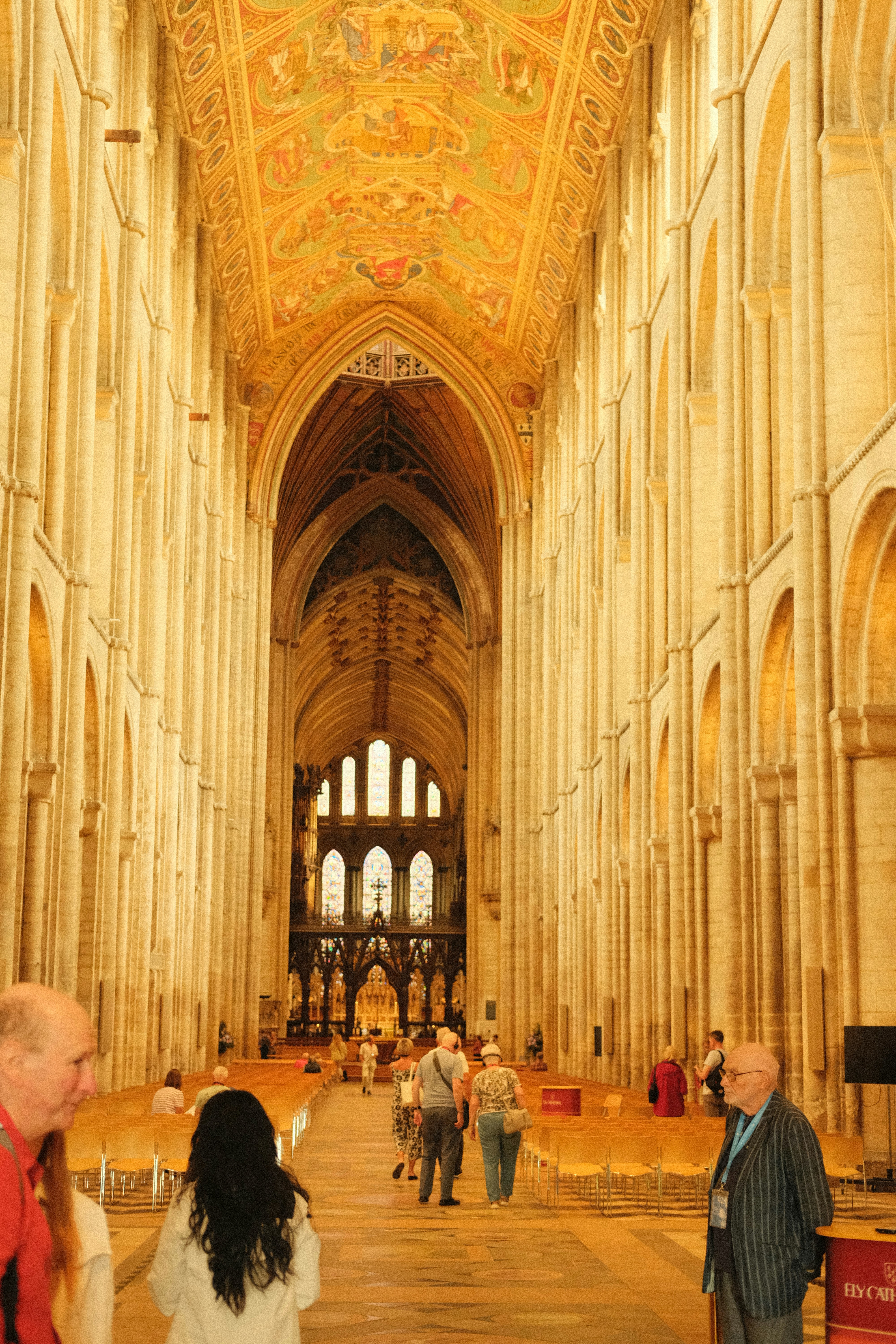 A group of people standing inside of a cathedral