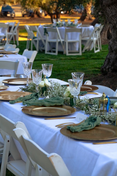 A table set up with place settings and place settings
