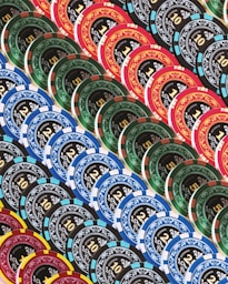 A pile of poker chips sitting on top of a table