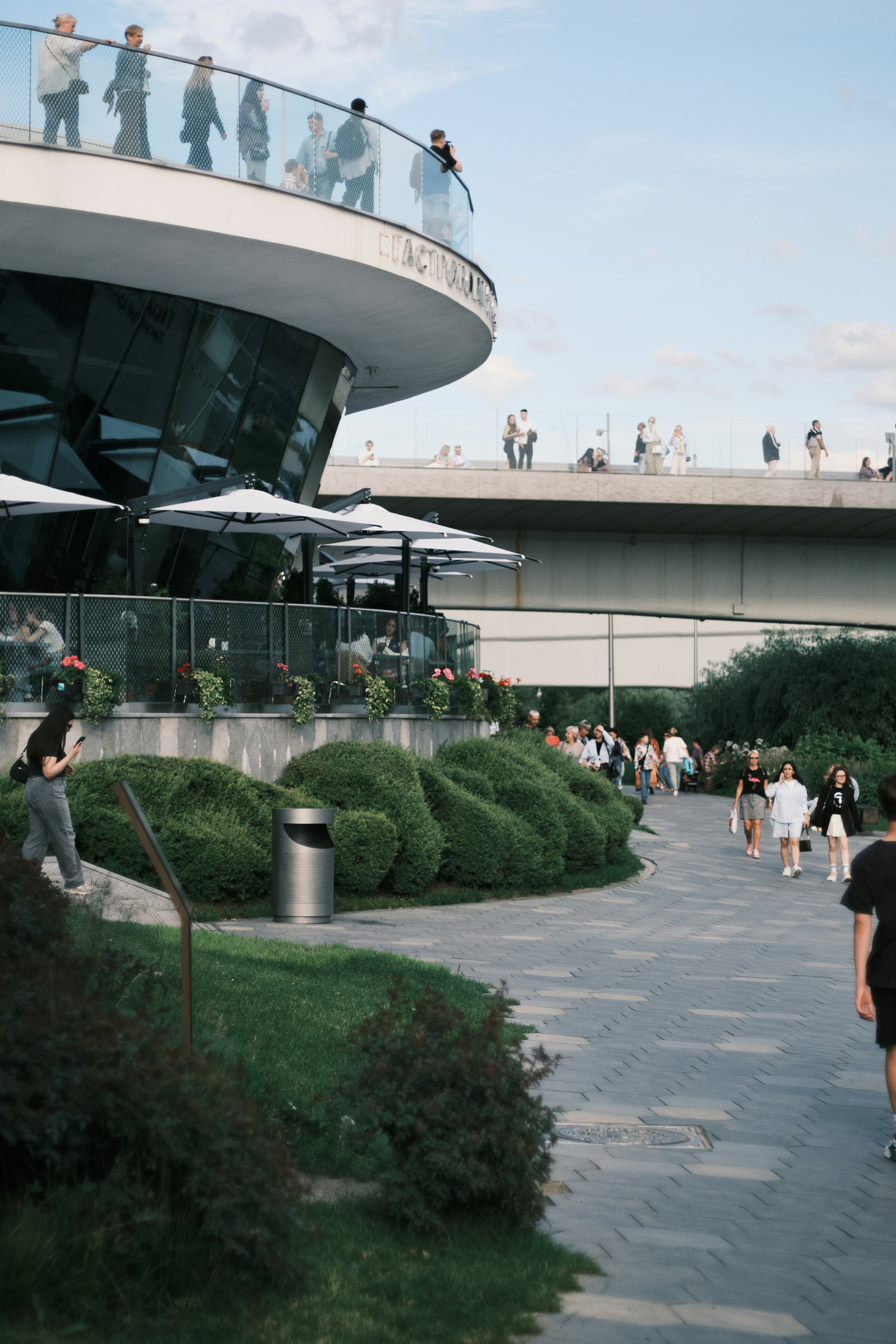 A group of people walking around a building