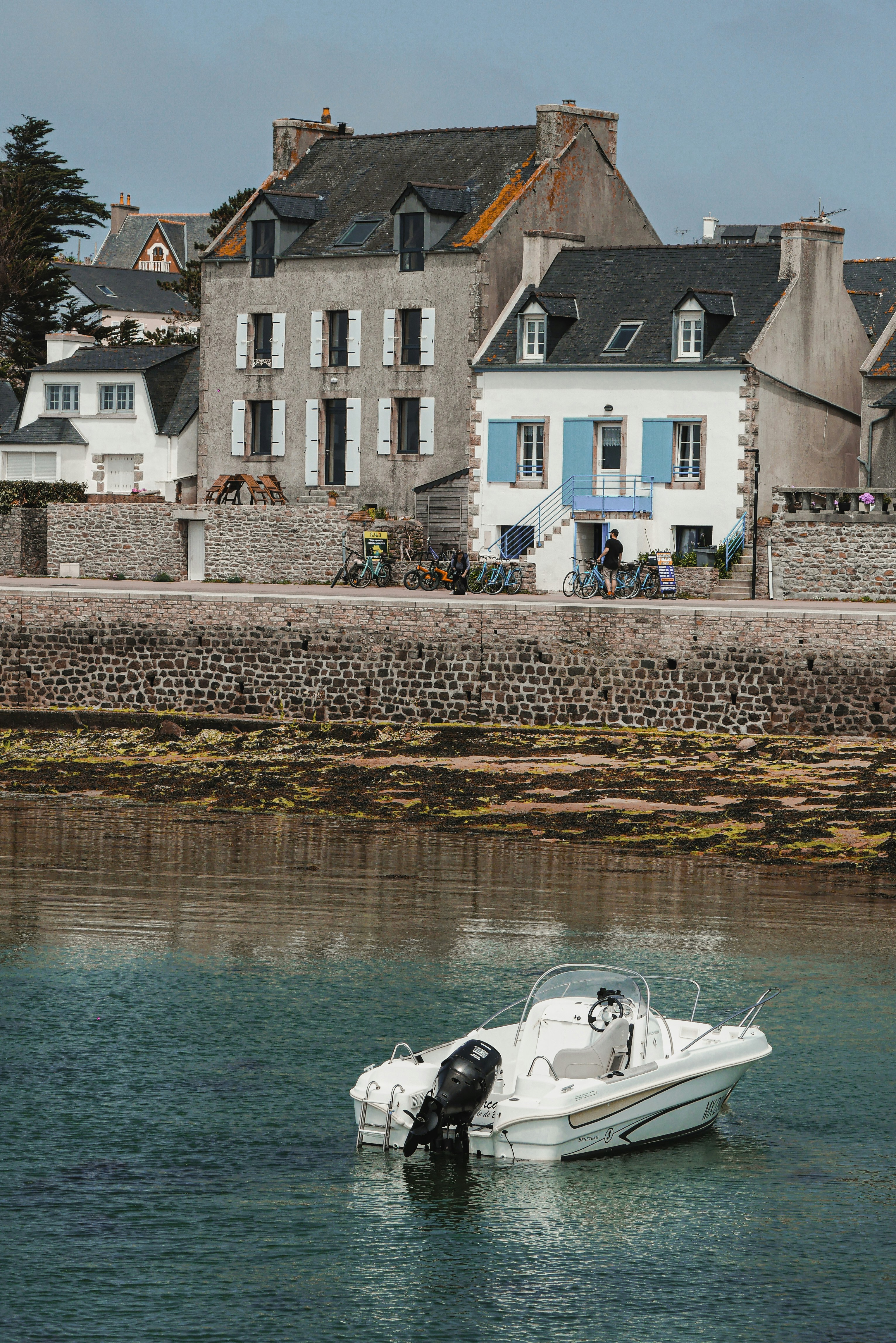 A white boat floating on top of a body of water photo – Free Wallpaper ...
