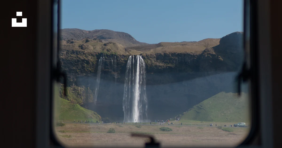 A view of a waterfall through a window photo – Free Nature Image on ...