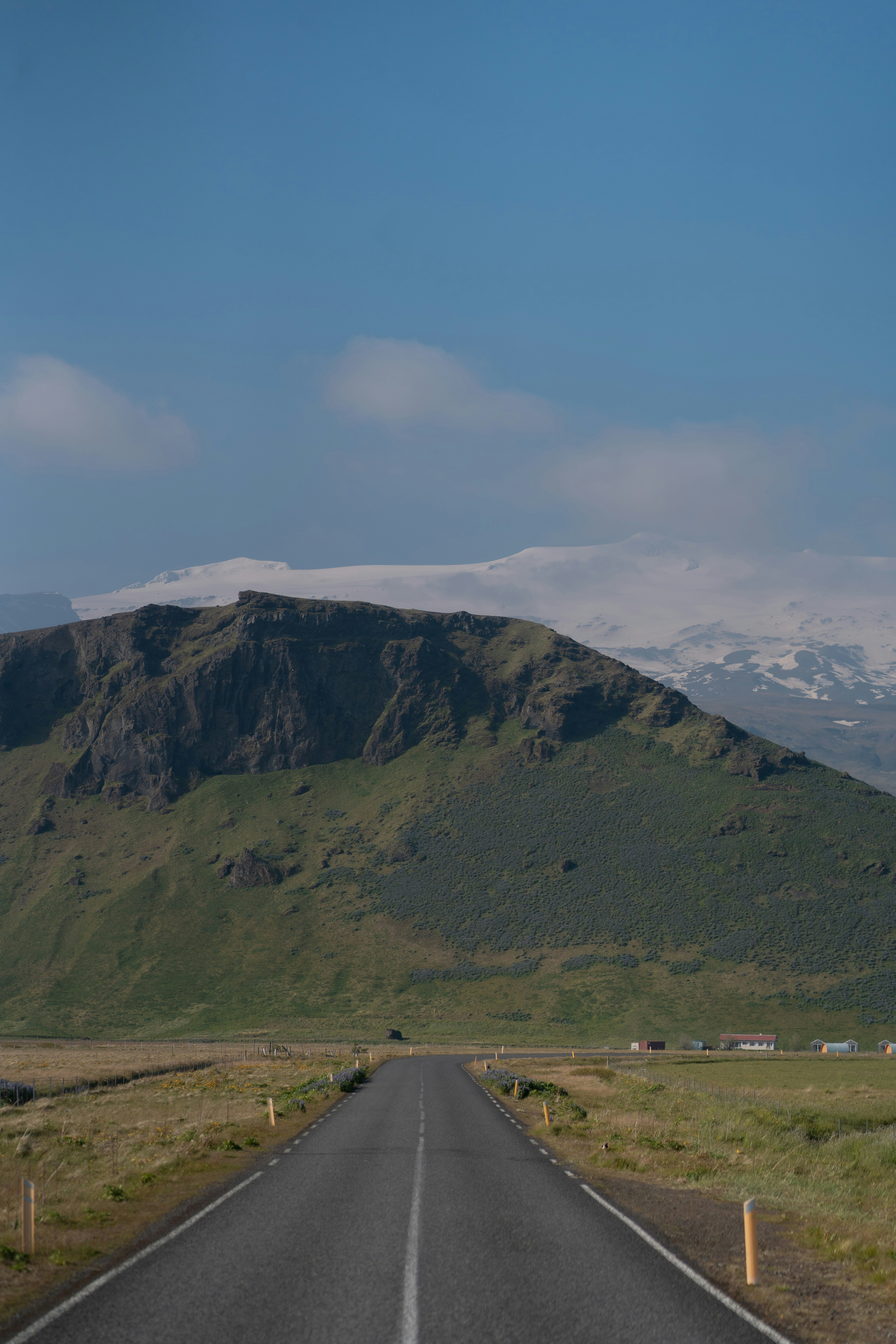 A road with a mountain in the background