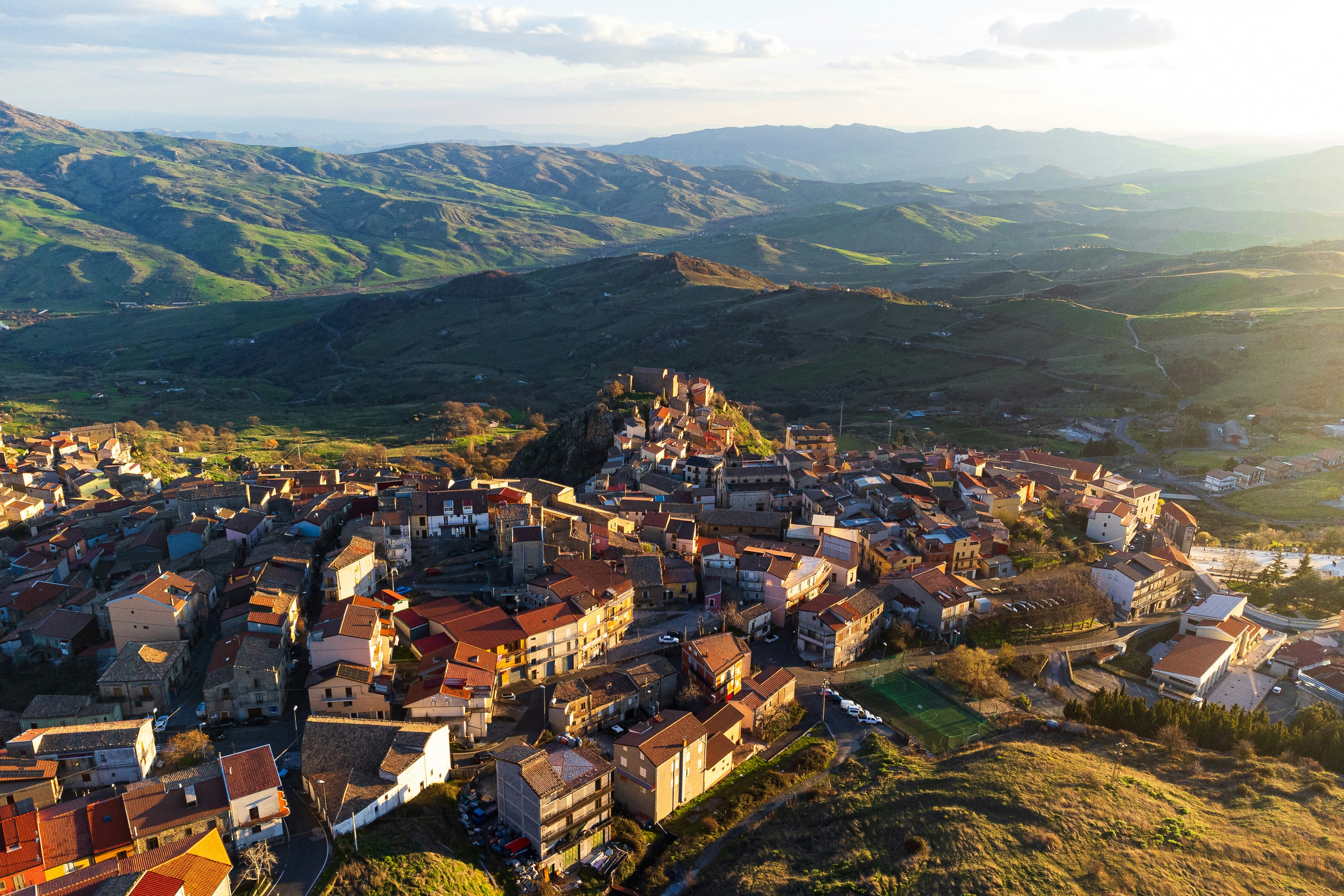 An aerial view of a village in the mountains, 