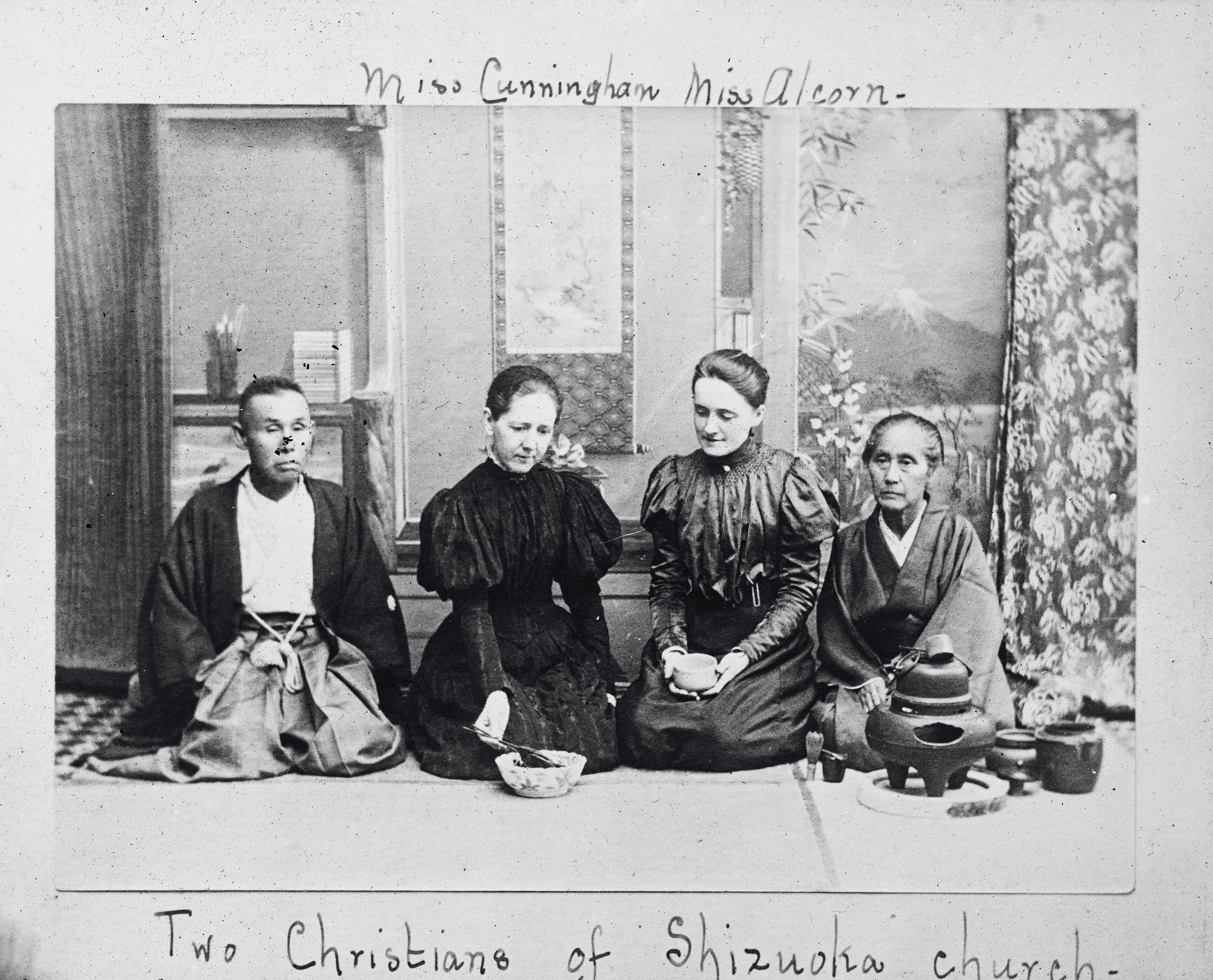 A group of women sitting next to each other