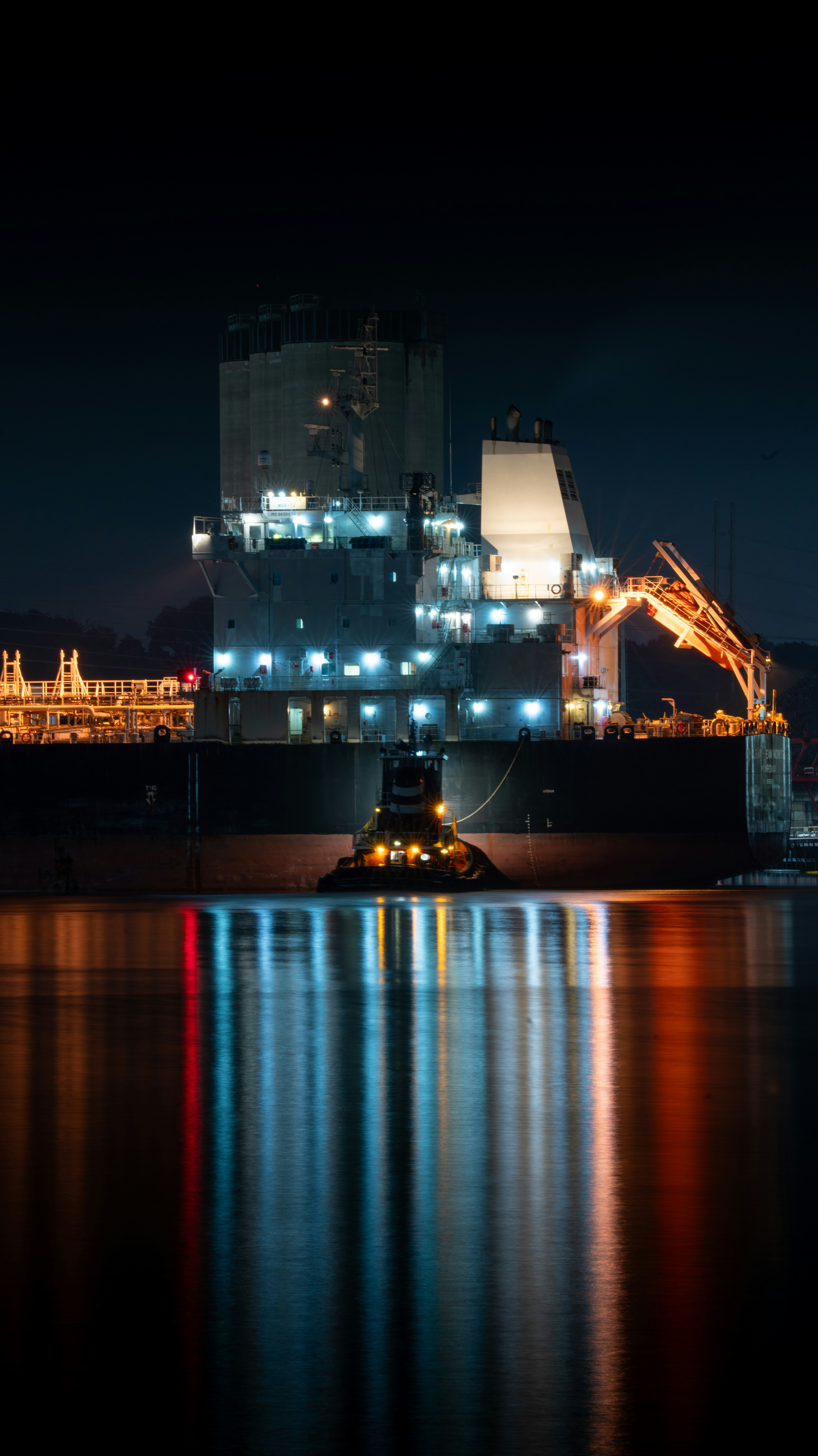 A large ship in a body of water at night