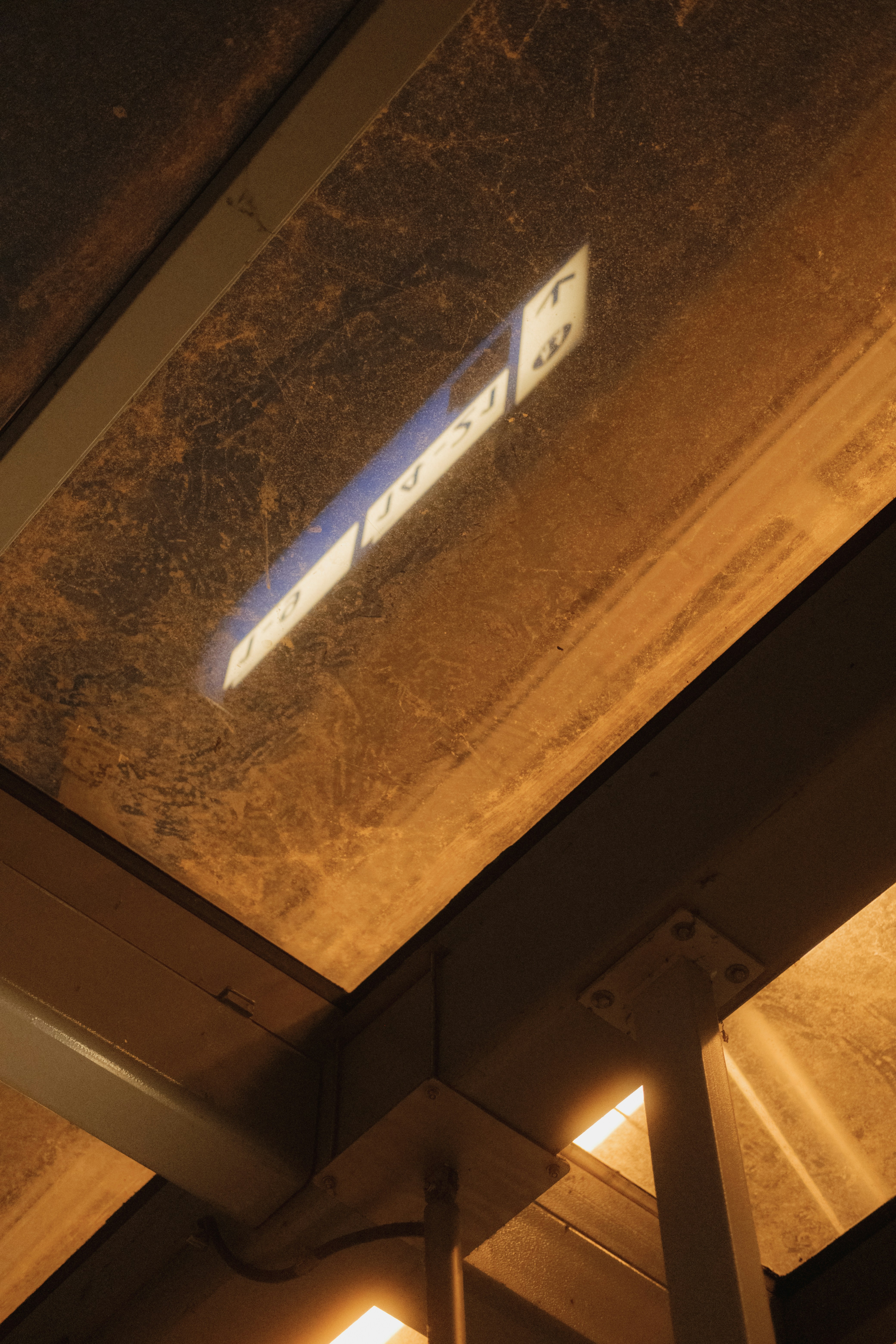 A street sign that is on the side of a building