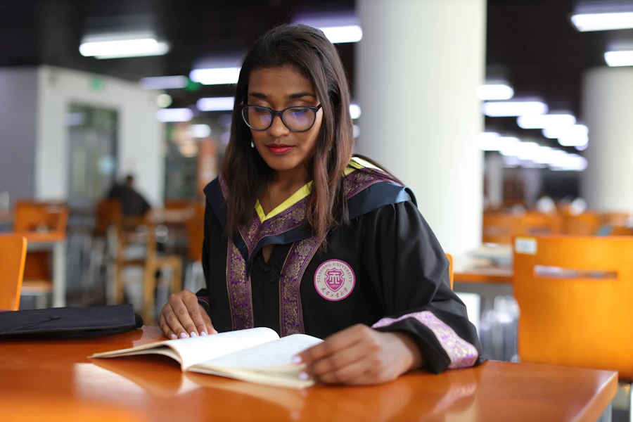 Student working at a table with a laptop