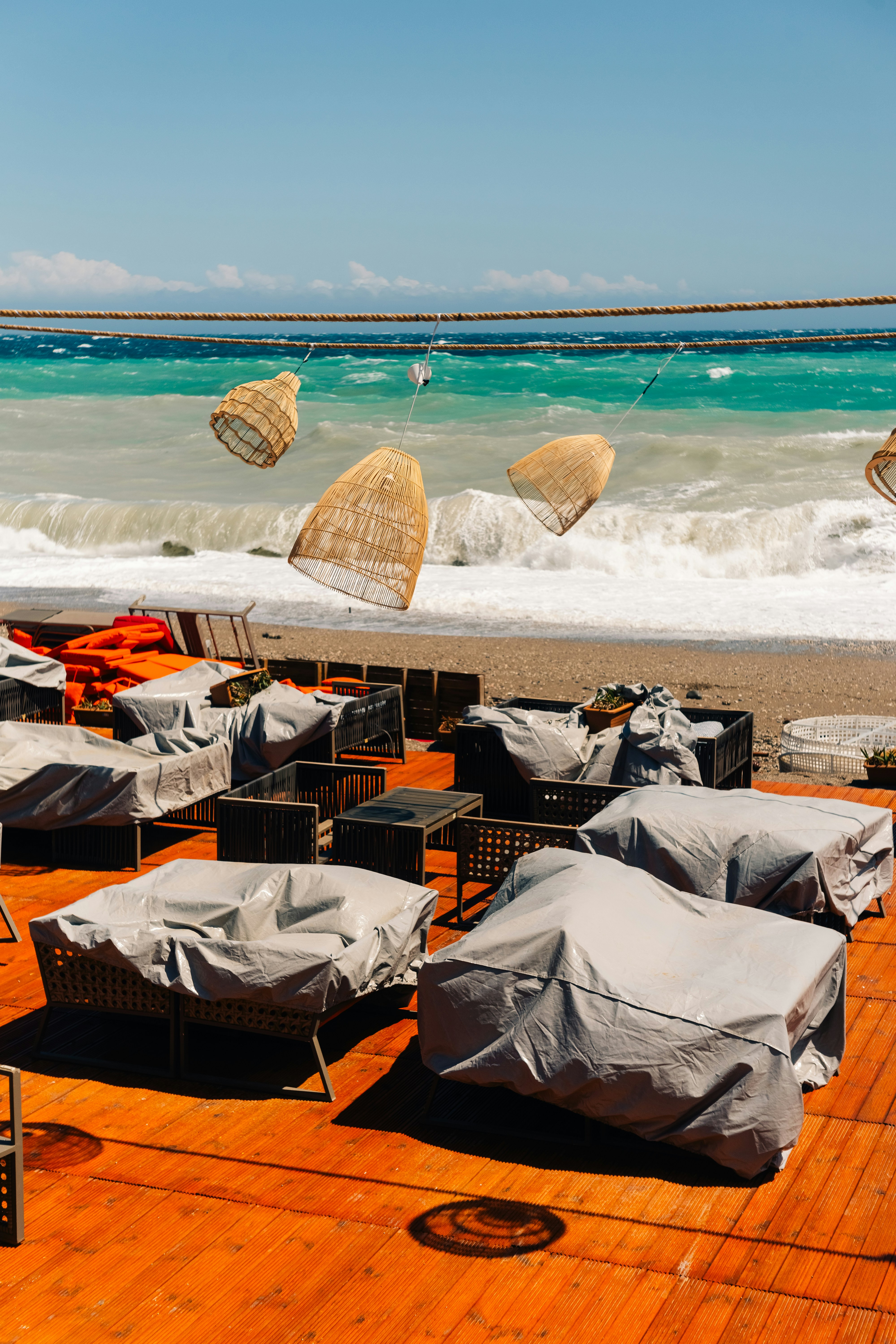 A bunch of chairs that are sitting on a beach
