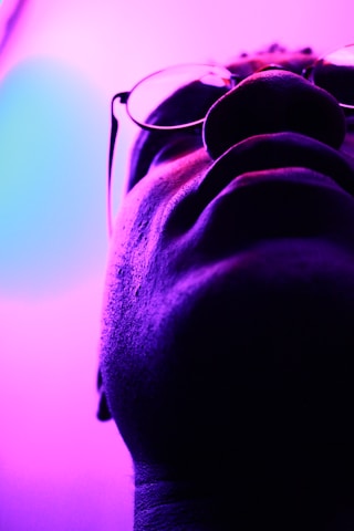 A pair of glasses sitting on top of a table