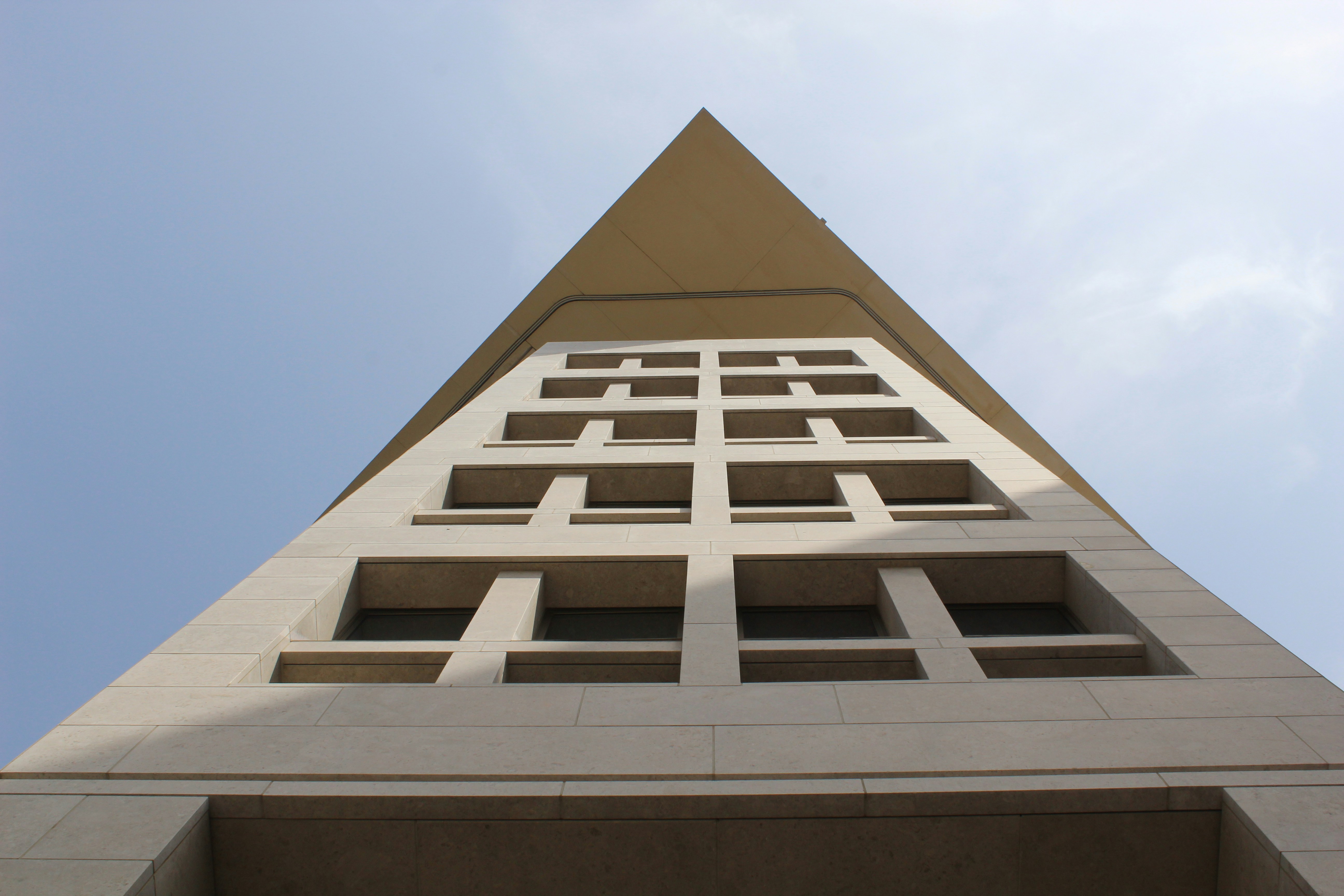 A very tall building with a sky in the background