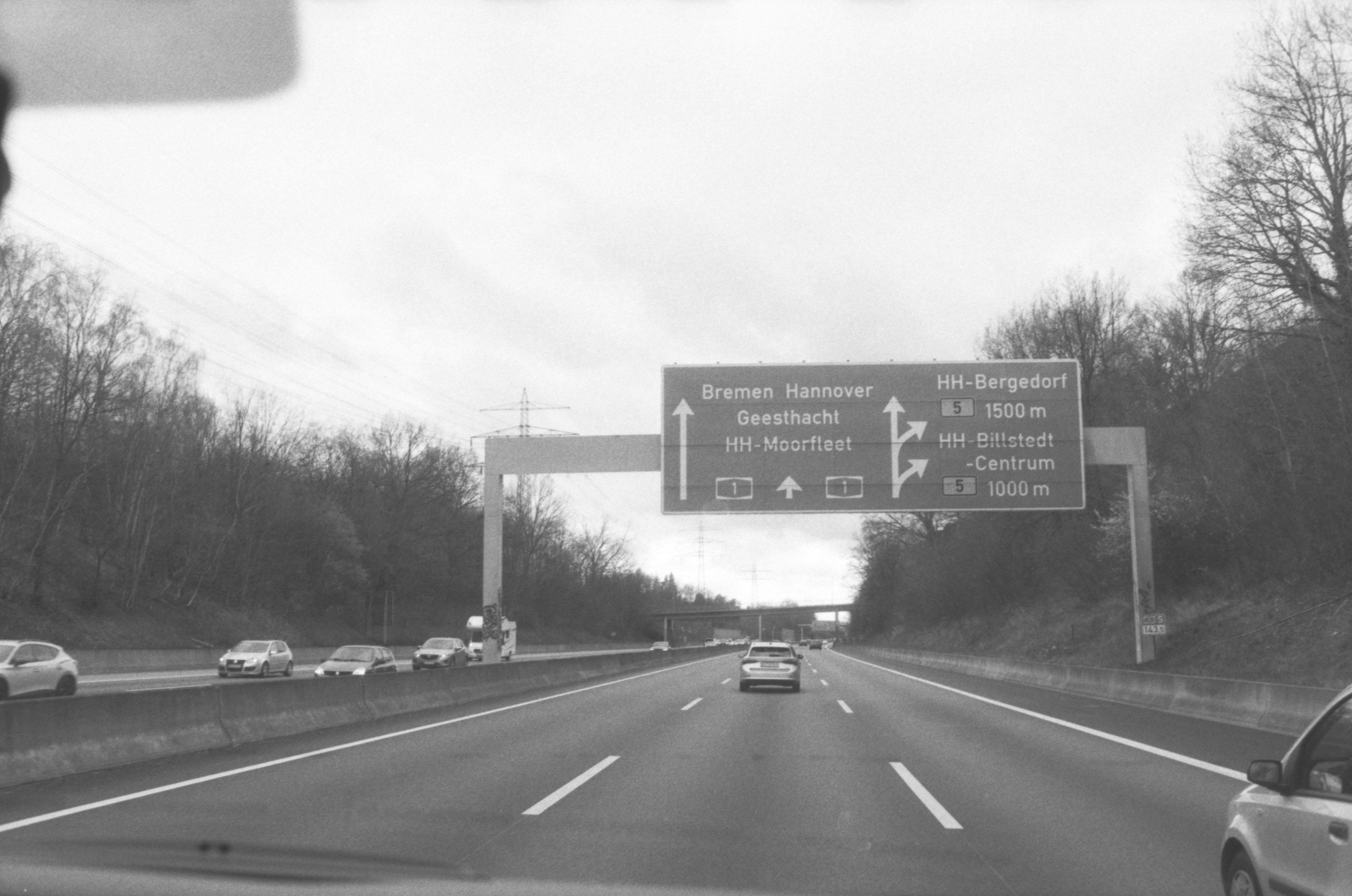 A black and white photo of a highway